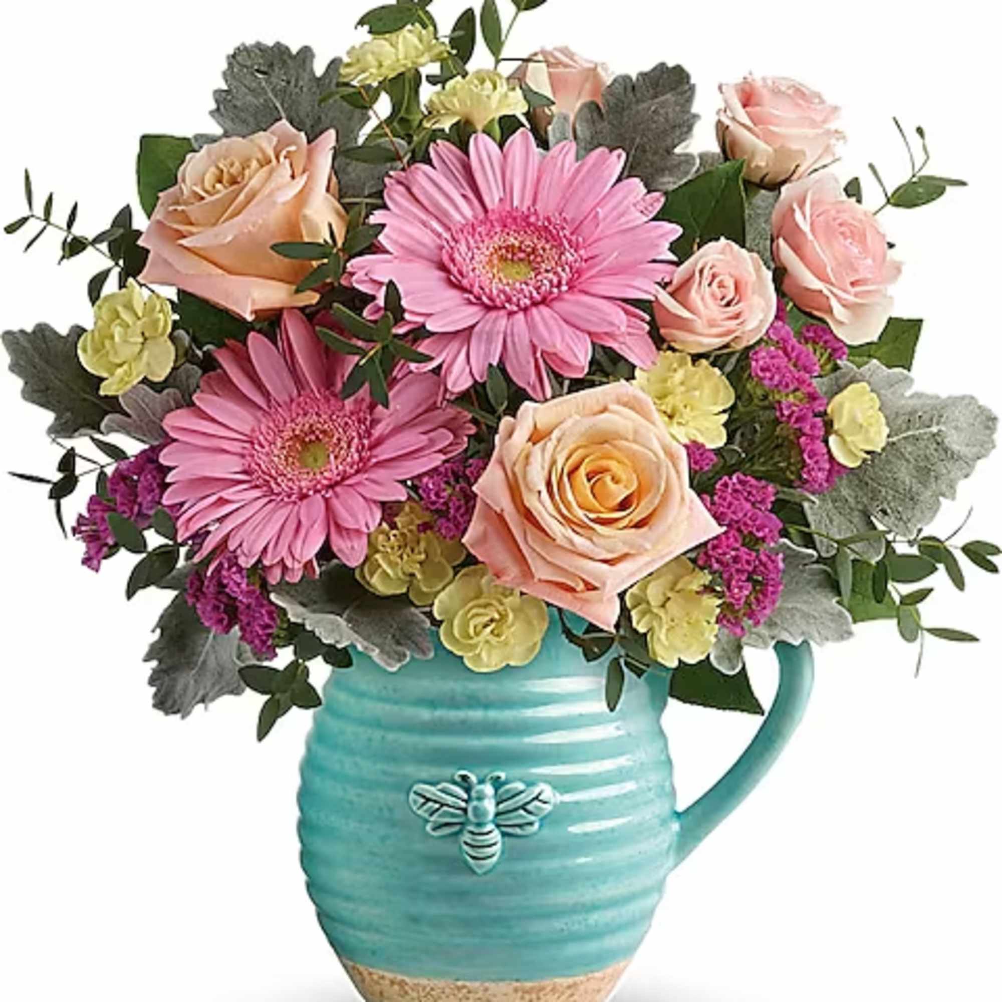 Pink and peach roses with pink daisies in a turquoise mug vase