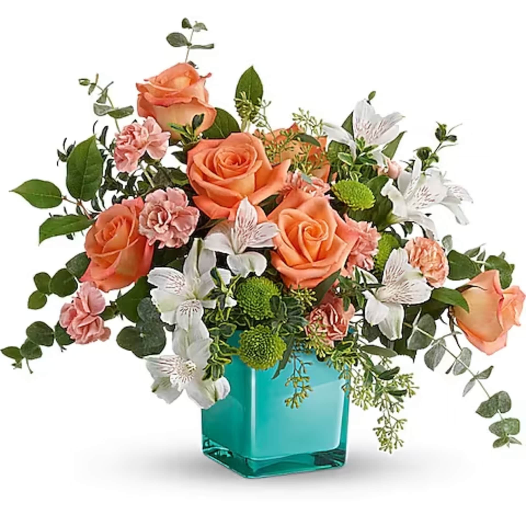 Peach roses and white alstroemeria in a turquoise glass vase