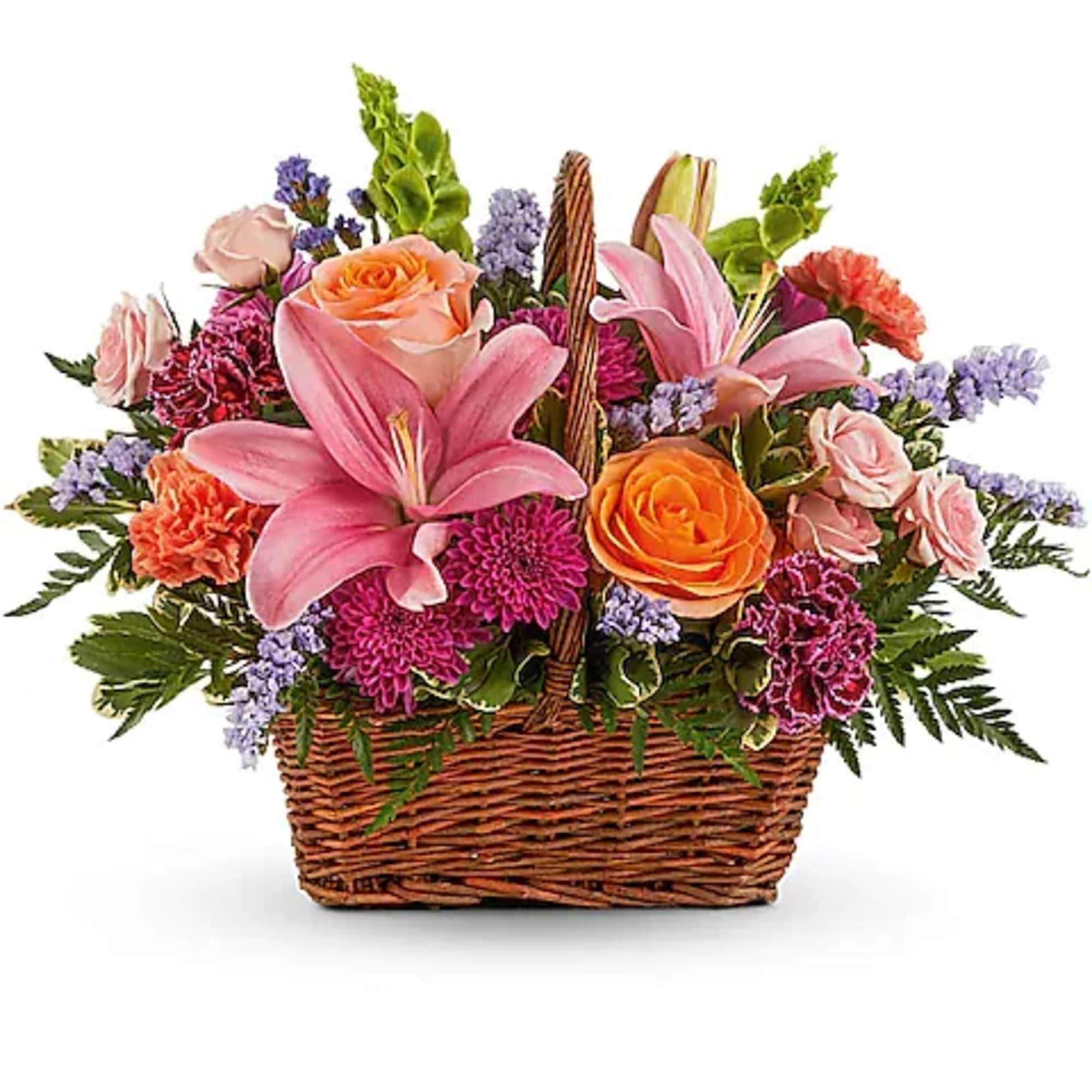 Basket arrangement with pink lilies, roses, and purple flowers