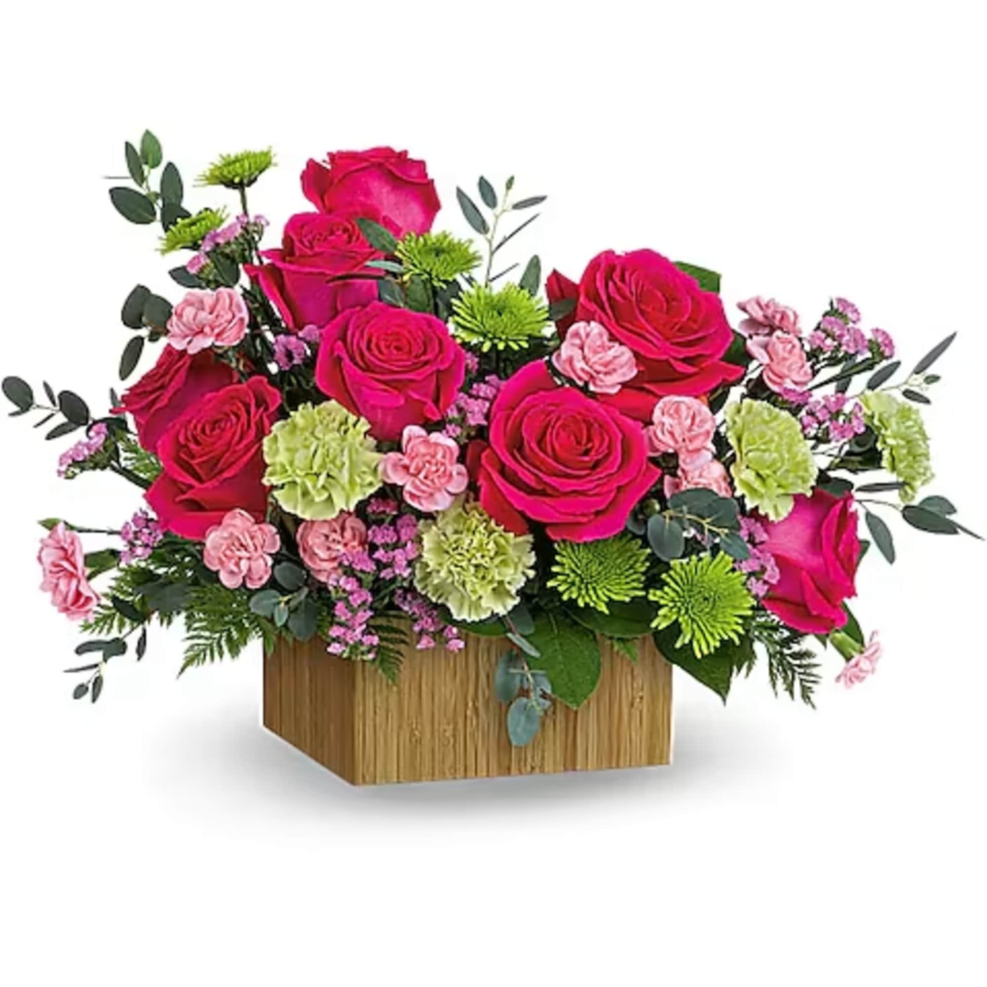 Pink rose arrangement in a wooden box with small carnations