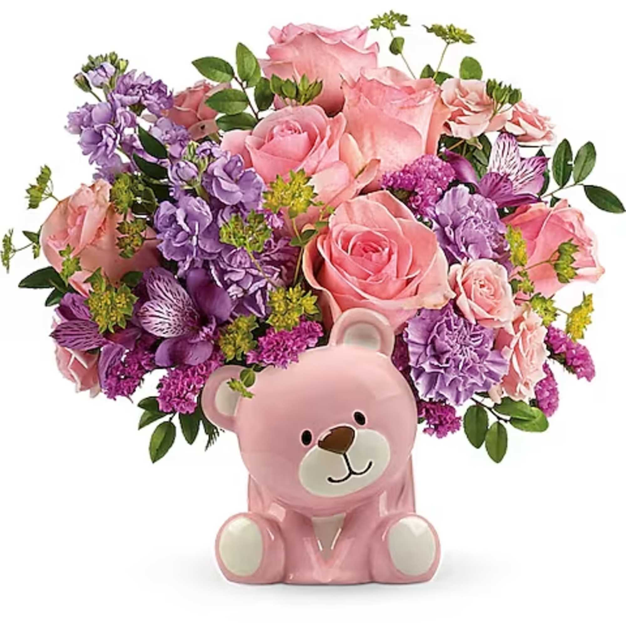 Pink and purple flower arrangement in a pink teddy bear container