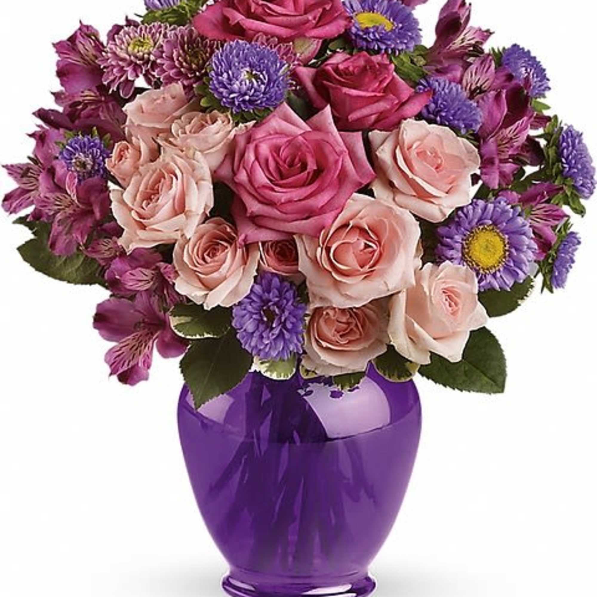 Pink and purple flower bouquet in a purple vase