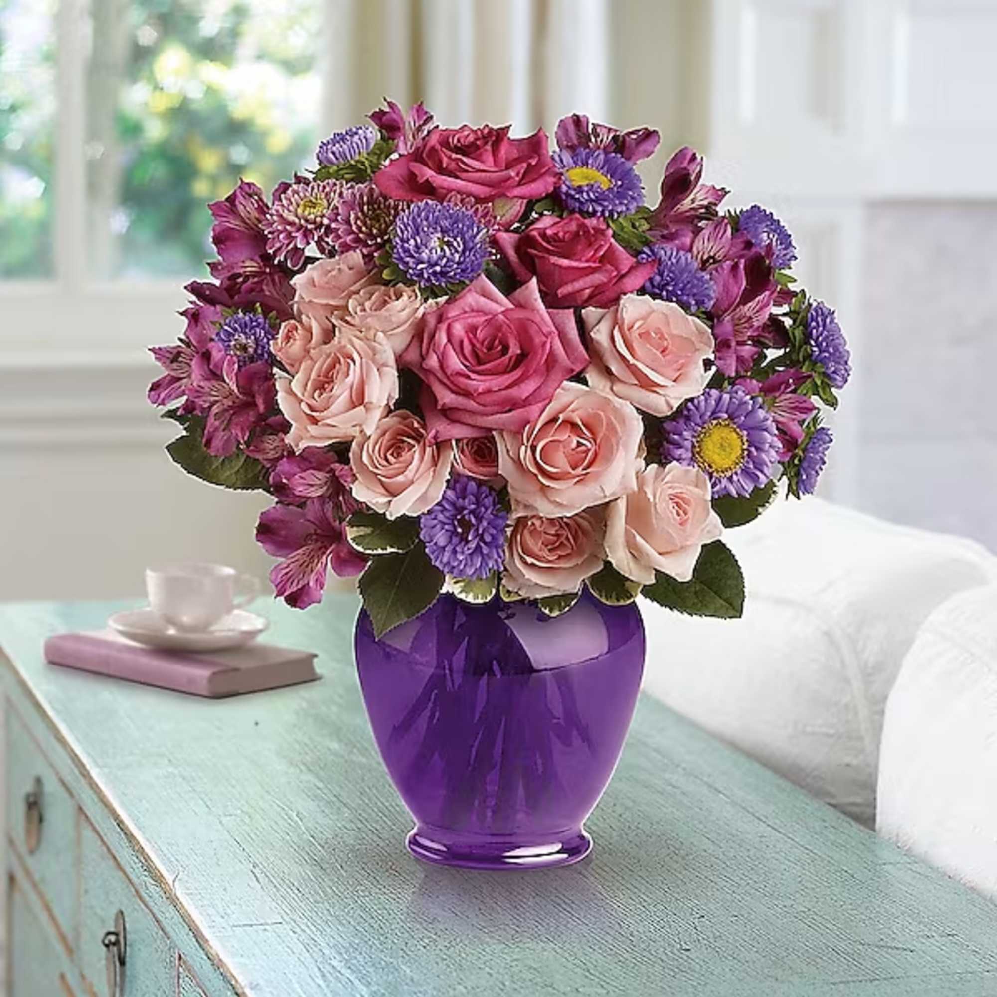 Pink and purple flower bouquet in a purple vase, photo 2 of 2