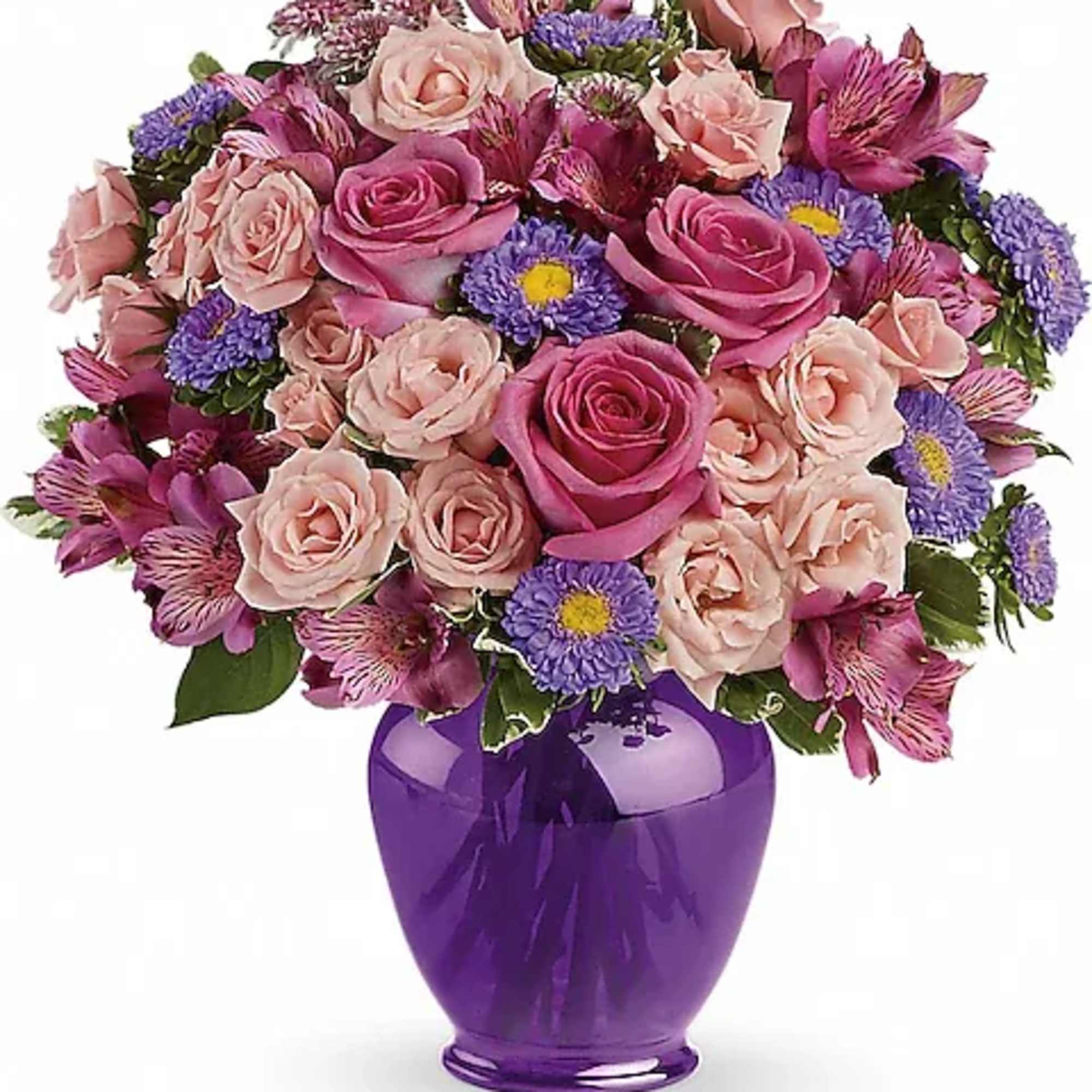 Pink and purple mixed bouquet in a purple vase