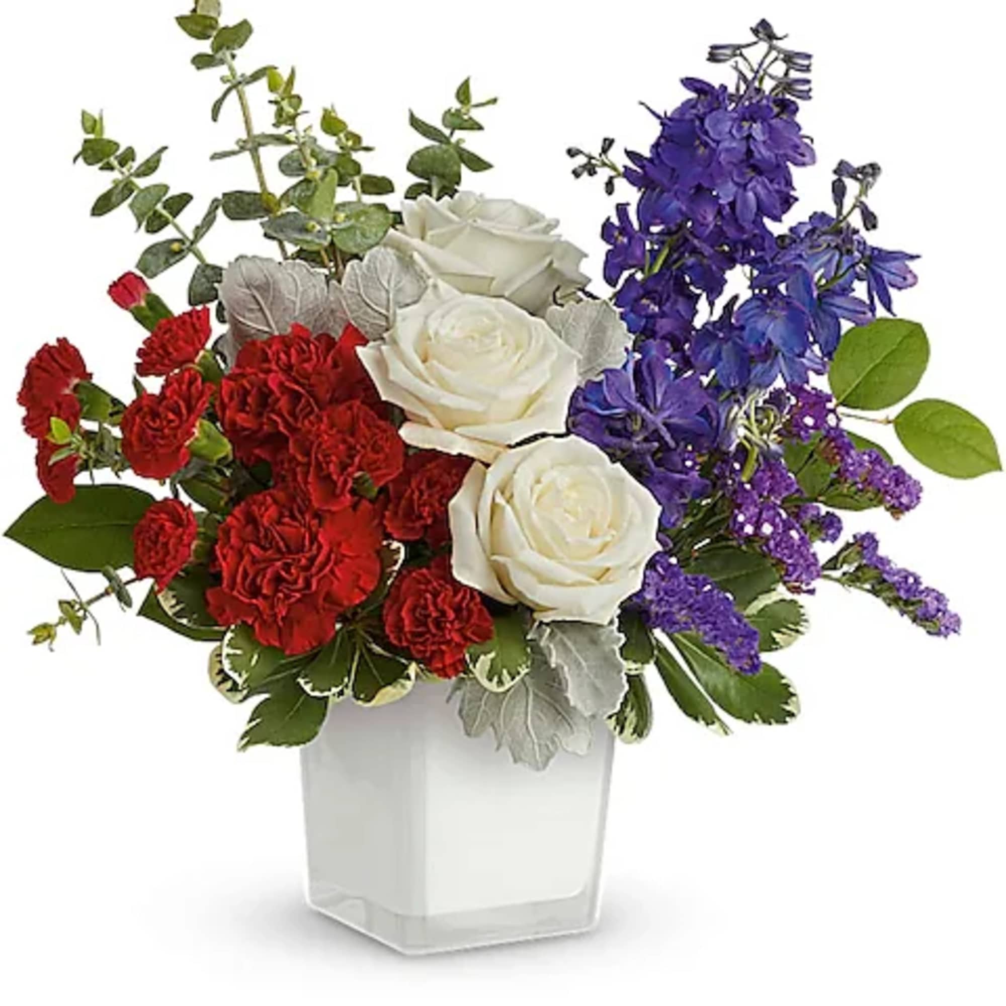 Red carnations, white roses, and purple flowers in a white vase