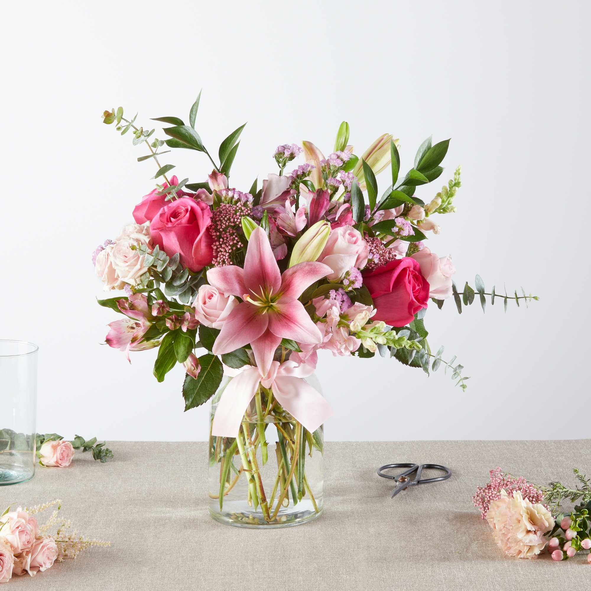 Pink and white mixed bouquet in a clear glass vase