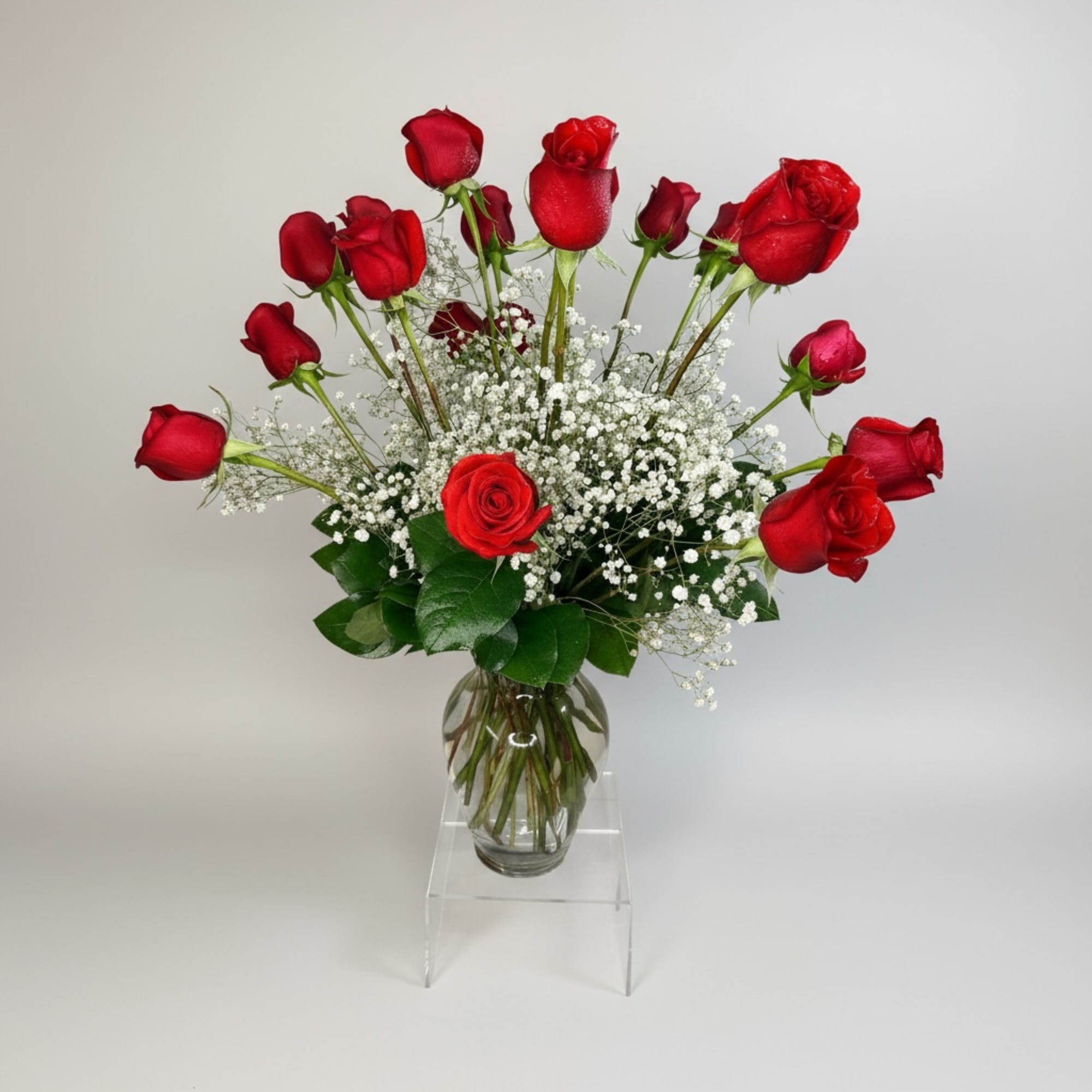 These dozen red roses with baby's breath are classic! Perfect romantic gift