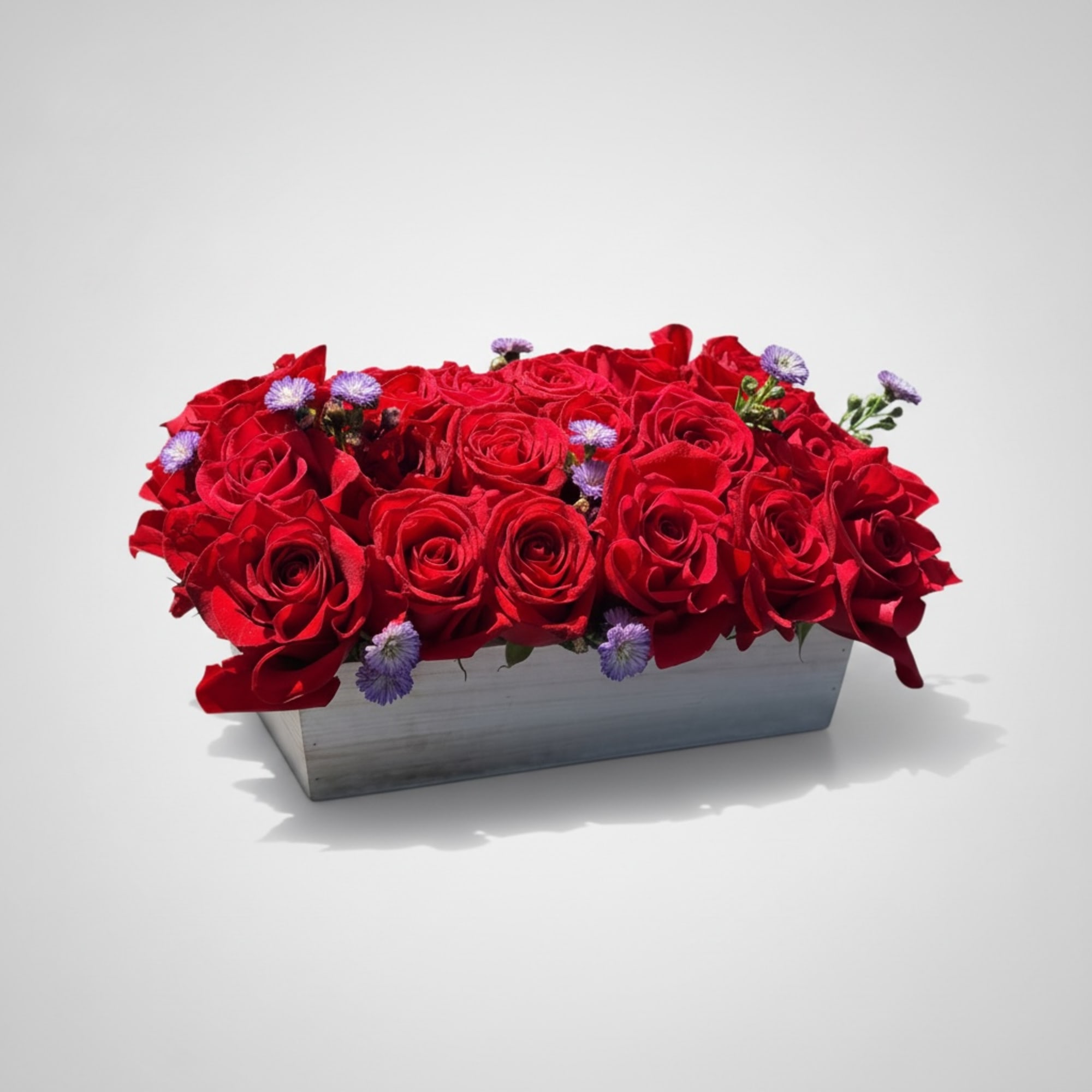 This eye-catching arrangement offers a modern twist on the classic dozen. Rustic