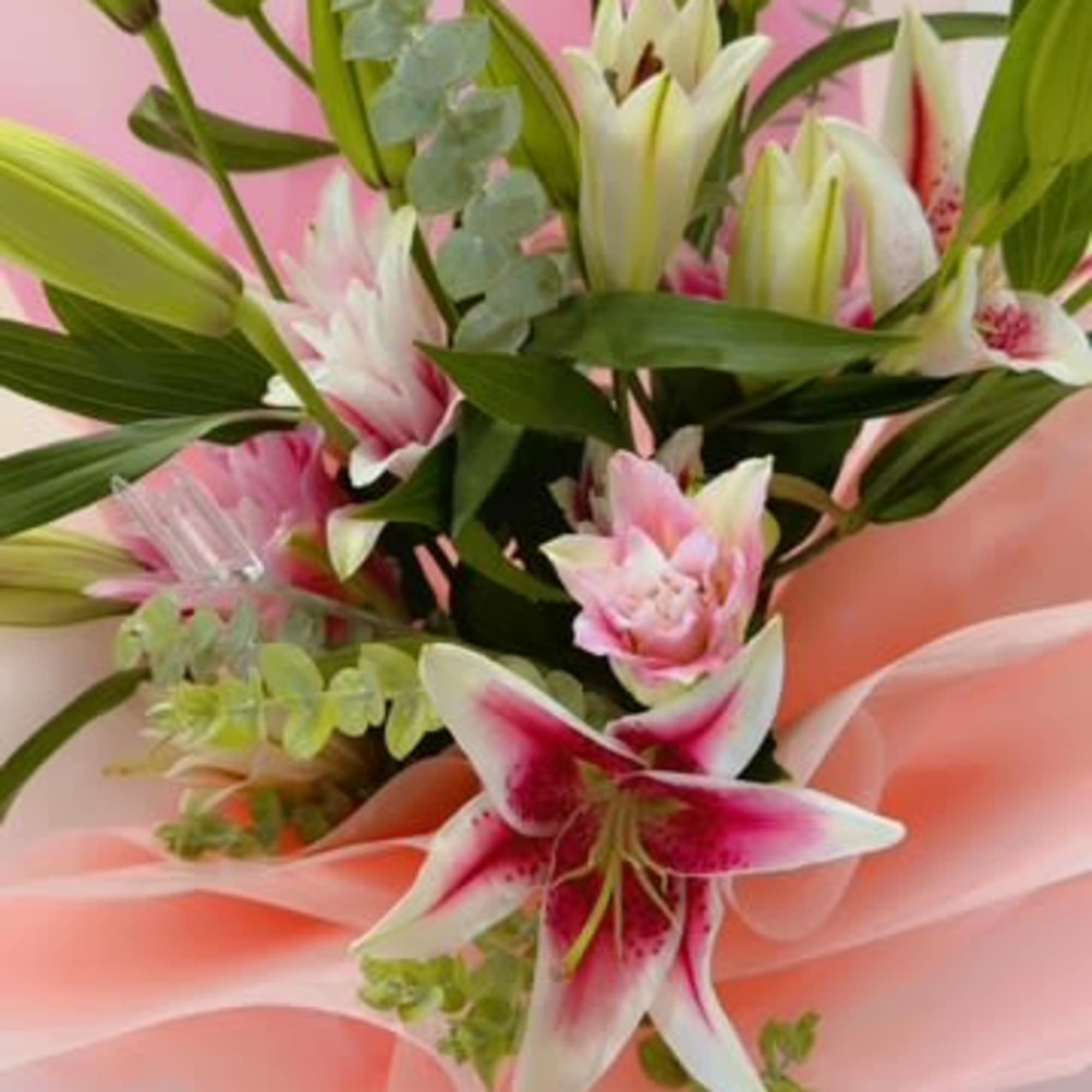 Bouquet of pink and white lilies wrapped in pink paper, photo 2 of 2