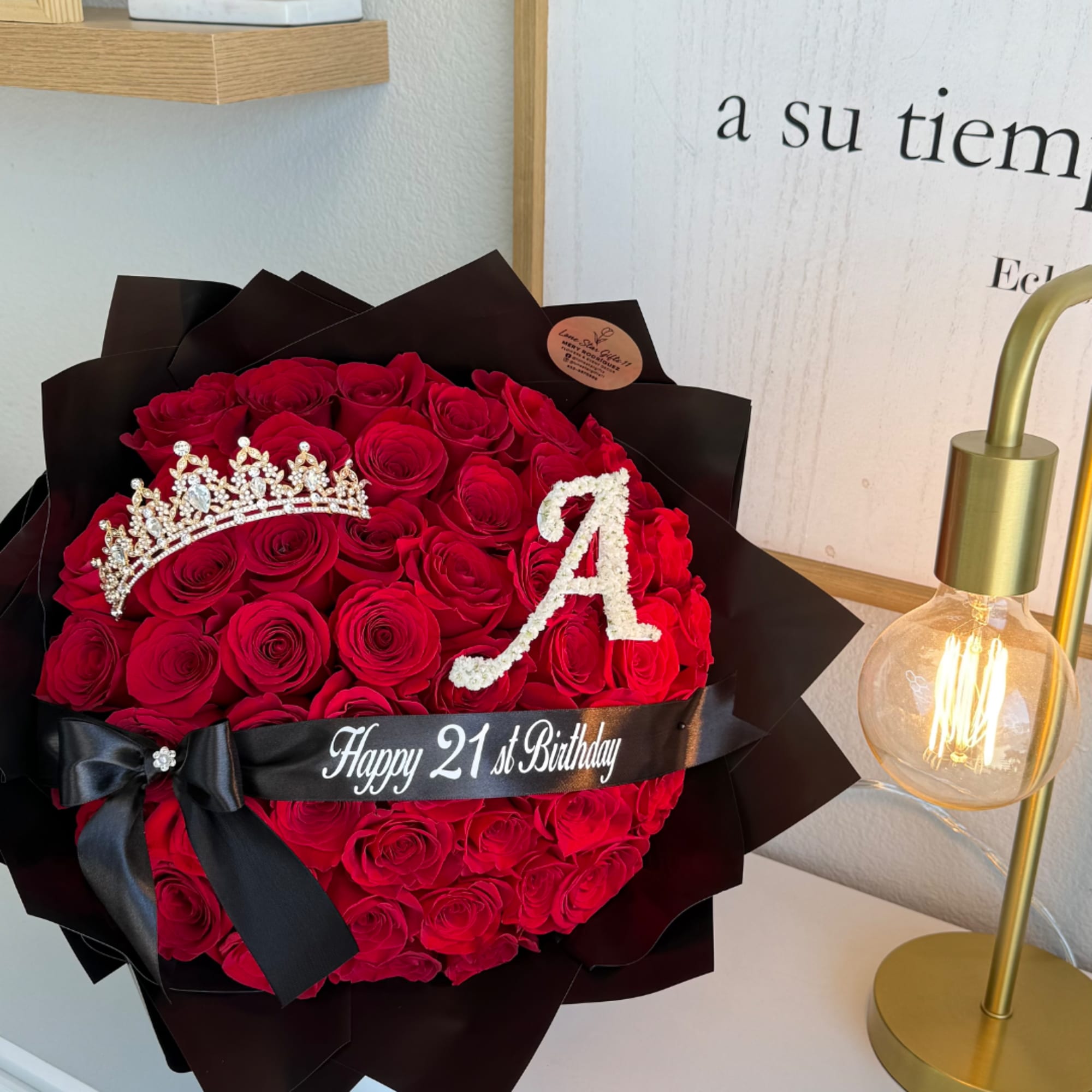 Red rose bouquet with a tiara and 21st birthday ribbon