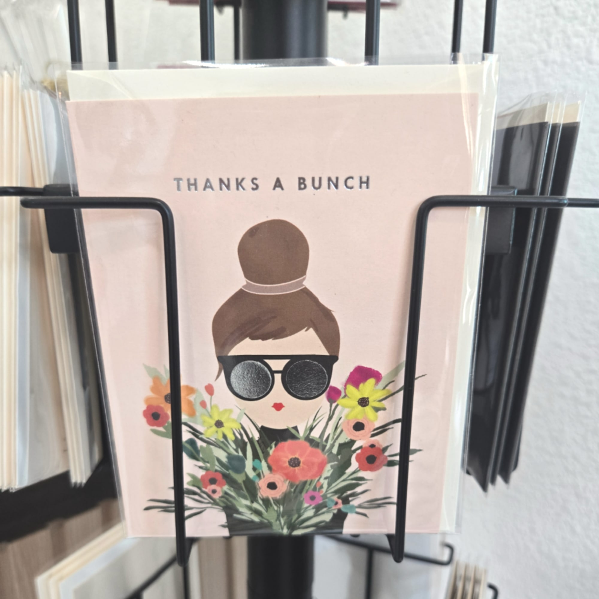 Greeting card with a floral illustration and the words "THANKS A BUNCH"