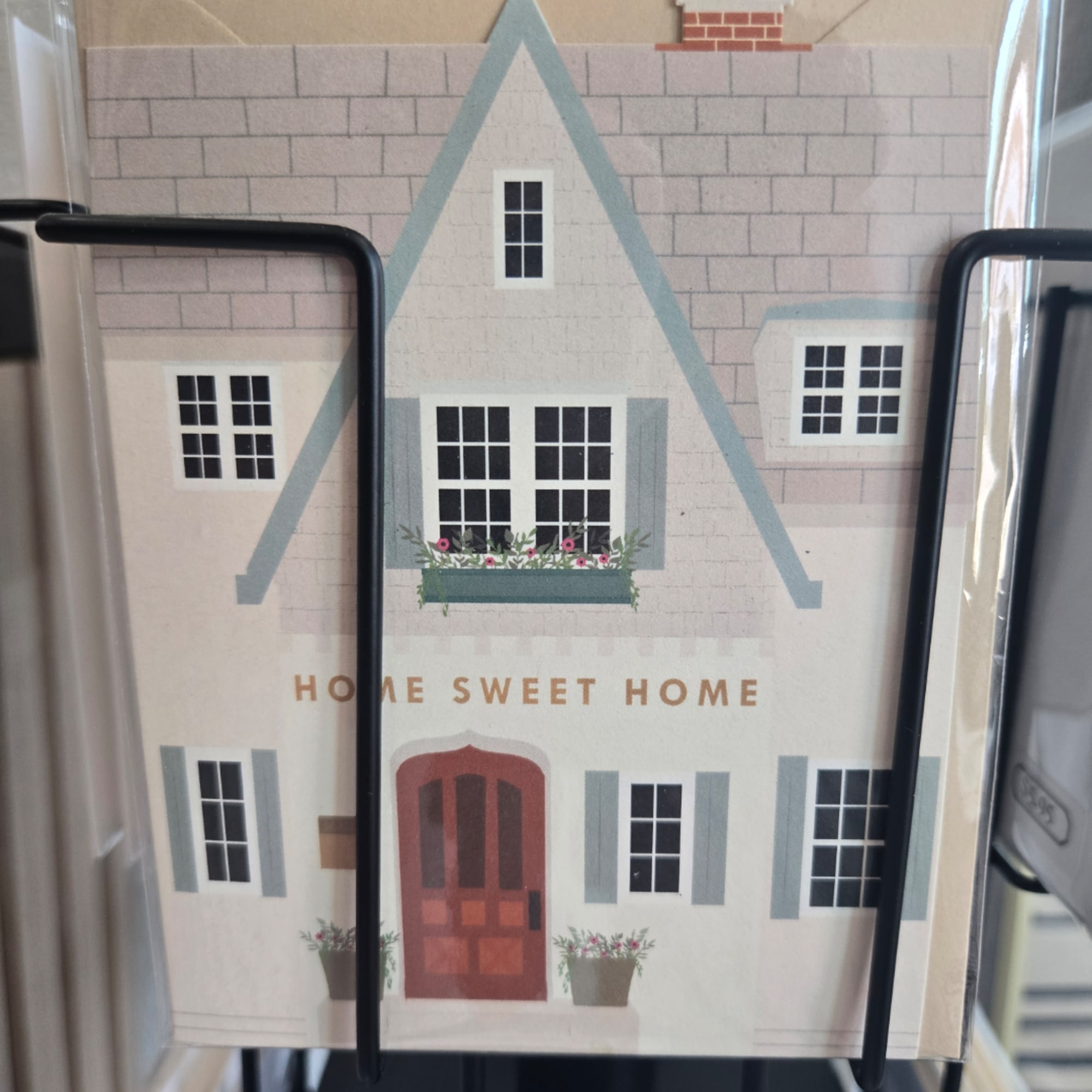 Decorative house-shaped sign with the words Home Sweet Home
