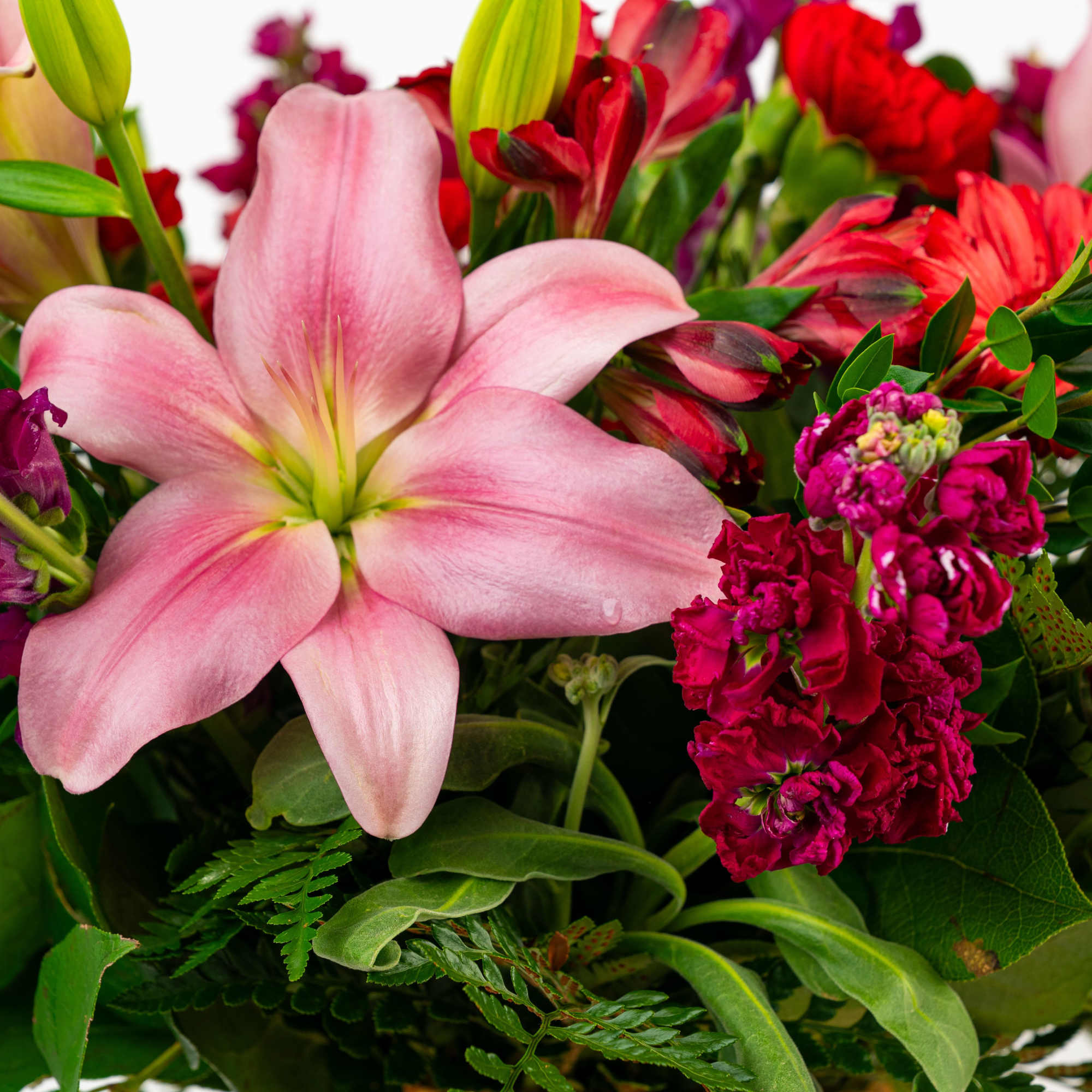 Pink lily bouquet with red and magenta flowers