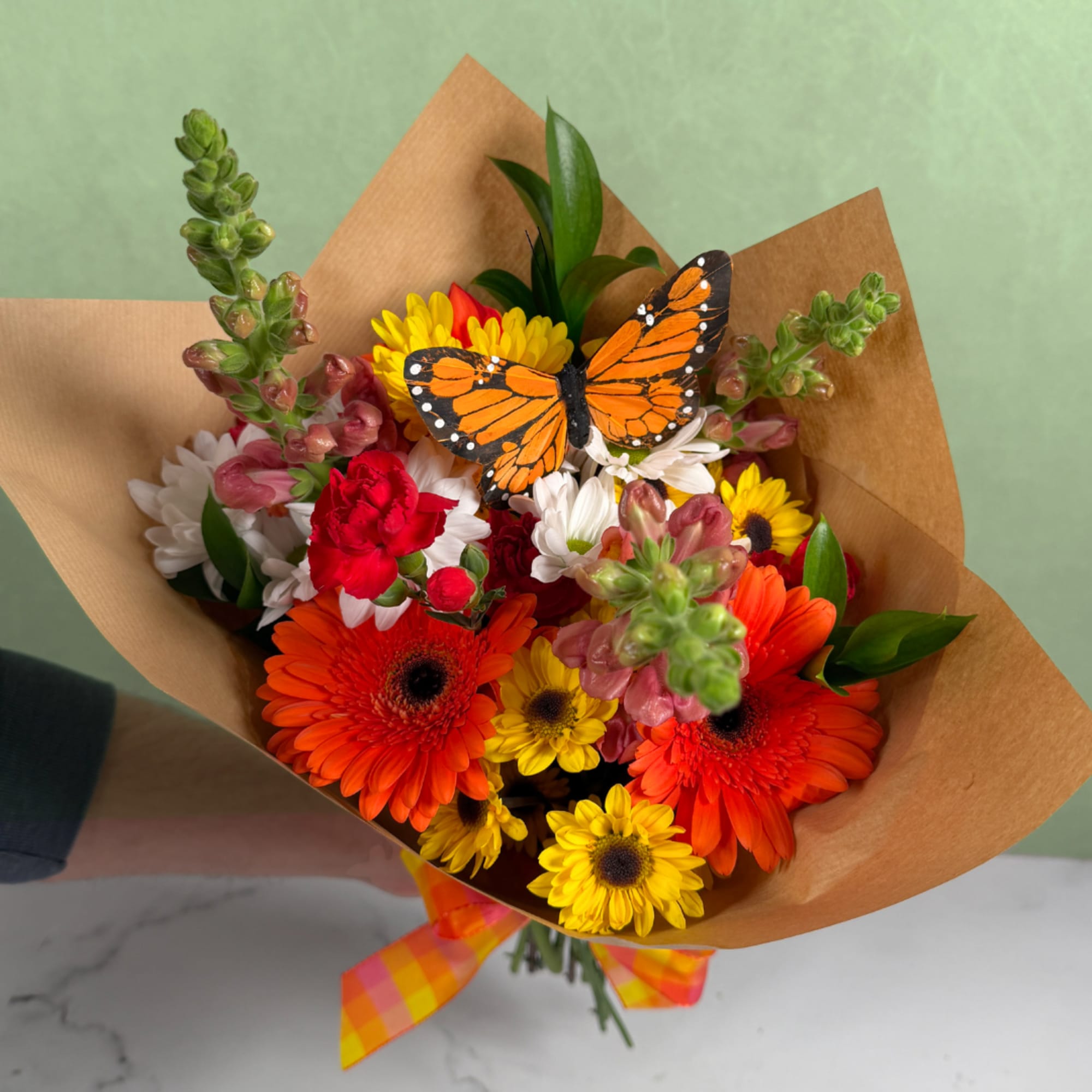 The Bright Beauty Butterfly Wrapped Bouquet is a beautiful assortment of warm, photo 2 of 3