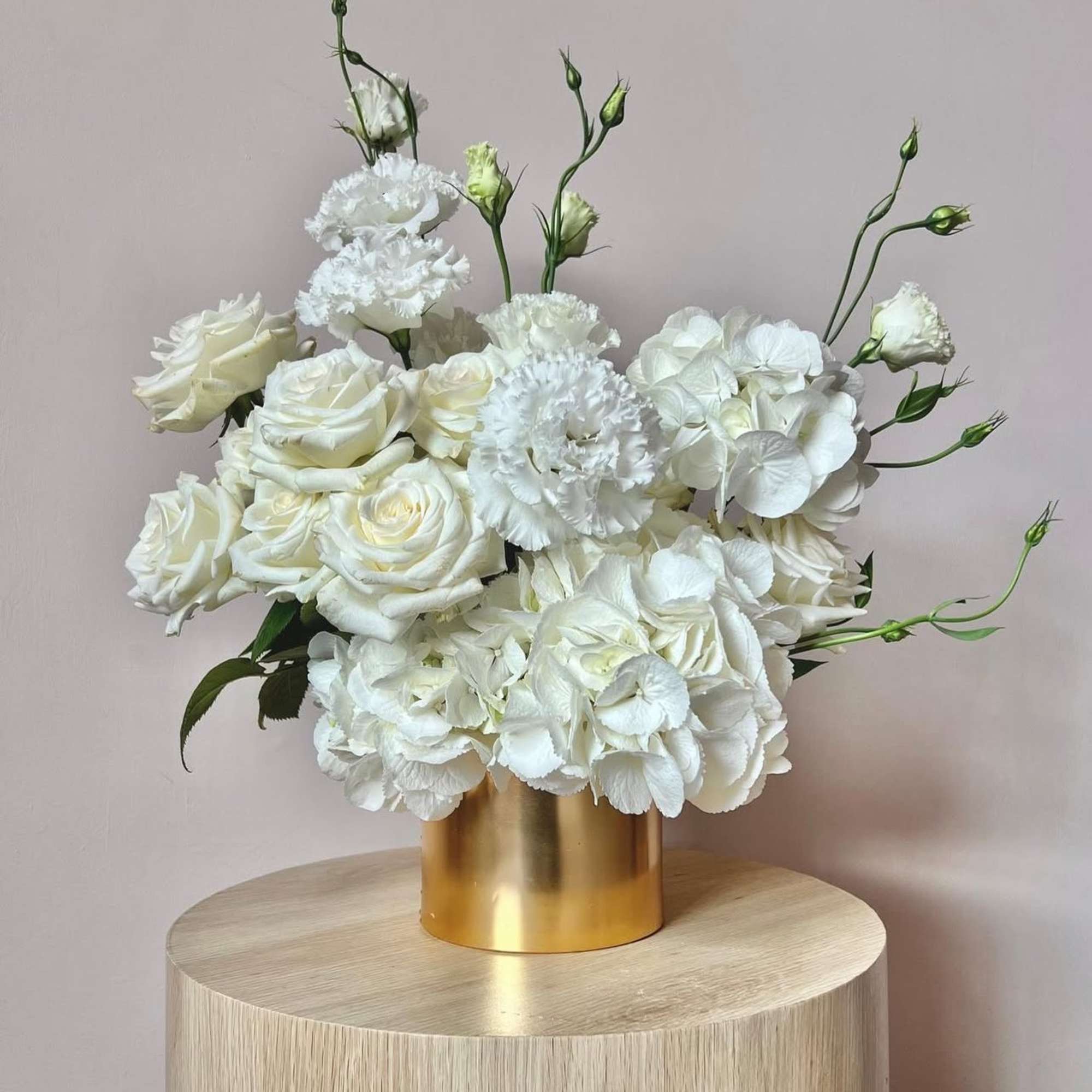 "Golden Radiance" is a sophisticated floral arrangement that effortlessly blends modern minimalism
