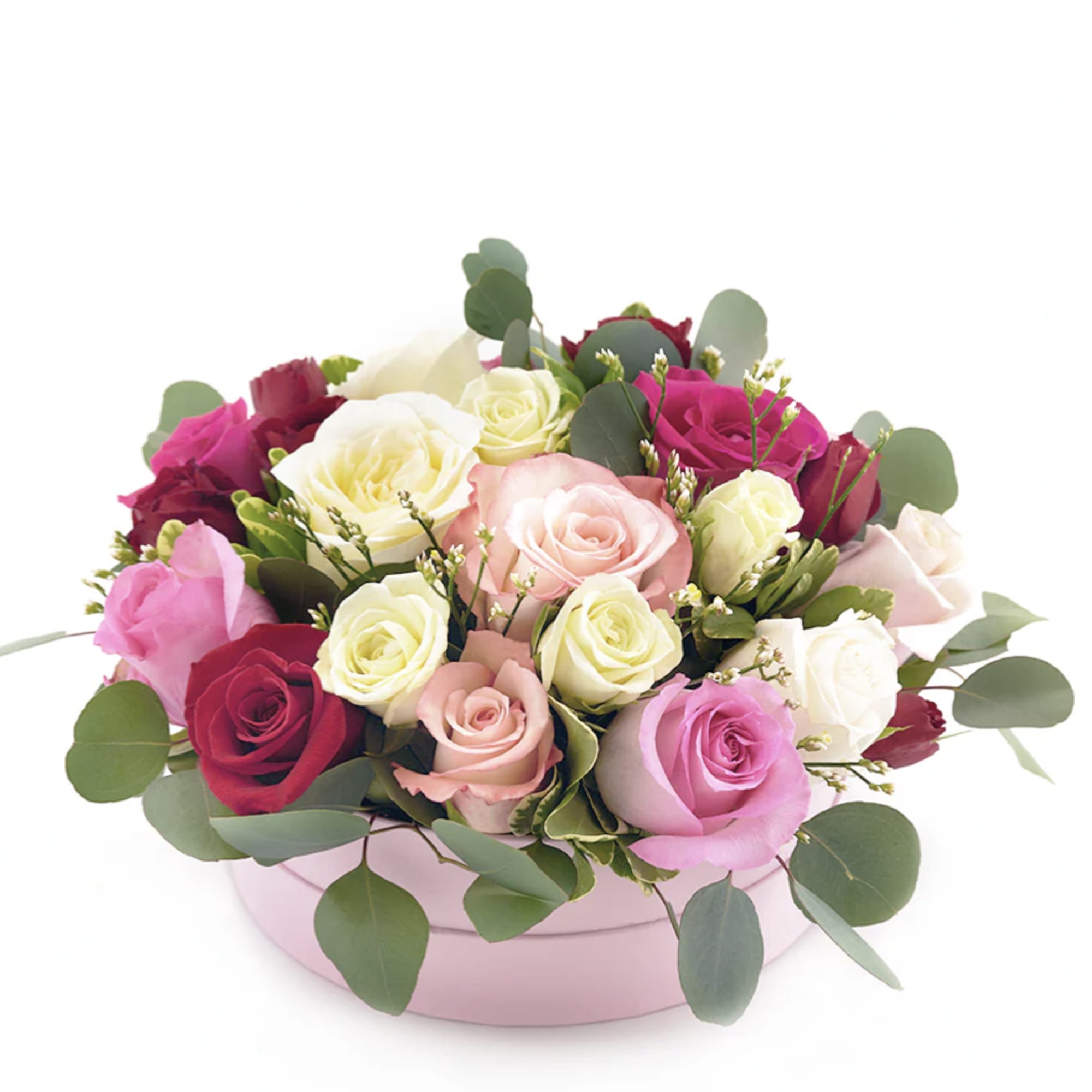 Mixed roses in a pink round box with eucalyptus