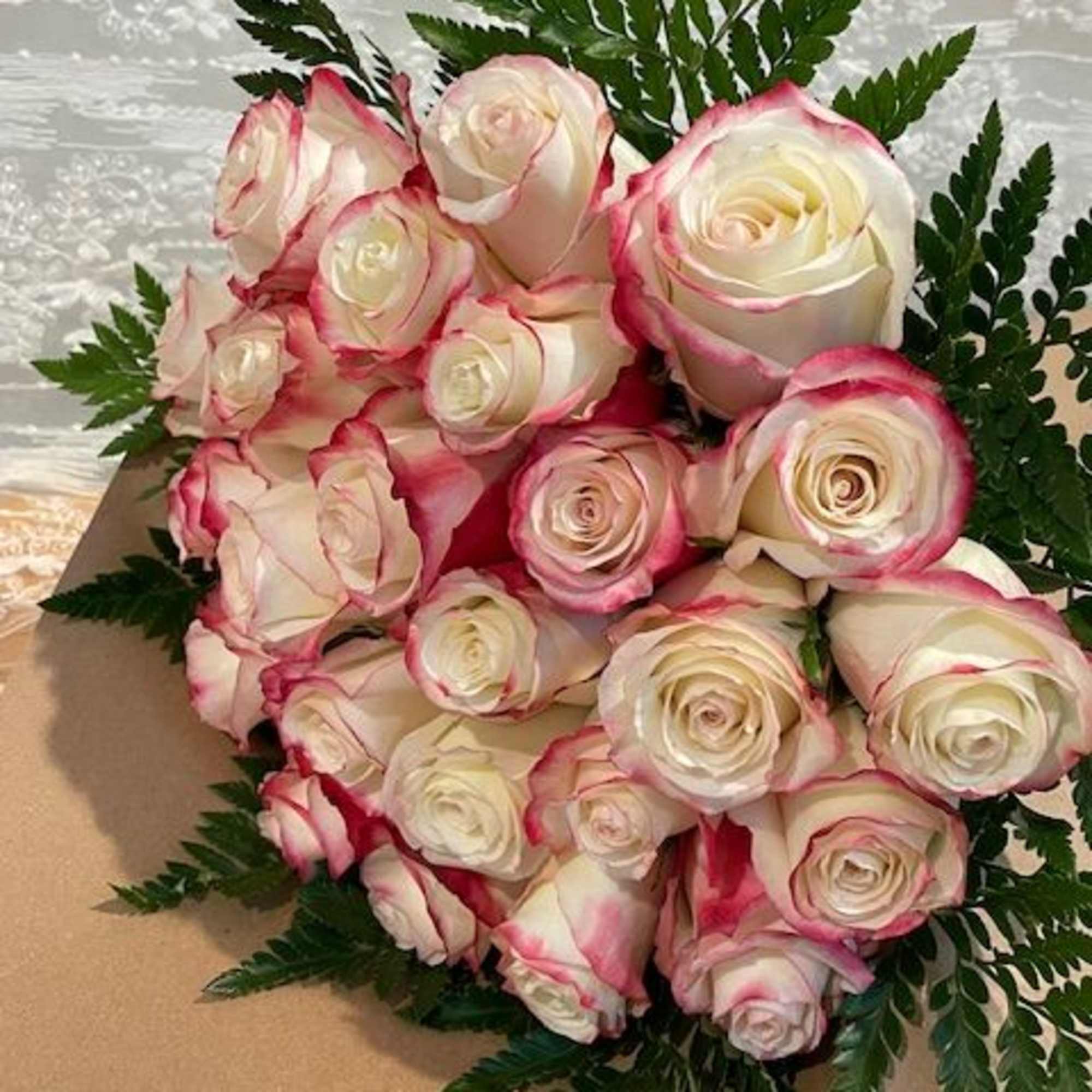 Two dozen roses hand wrapped 