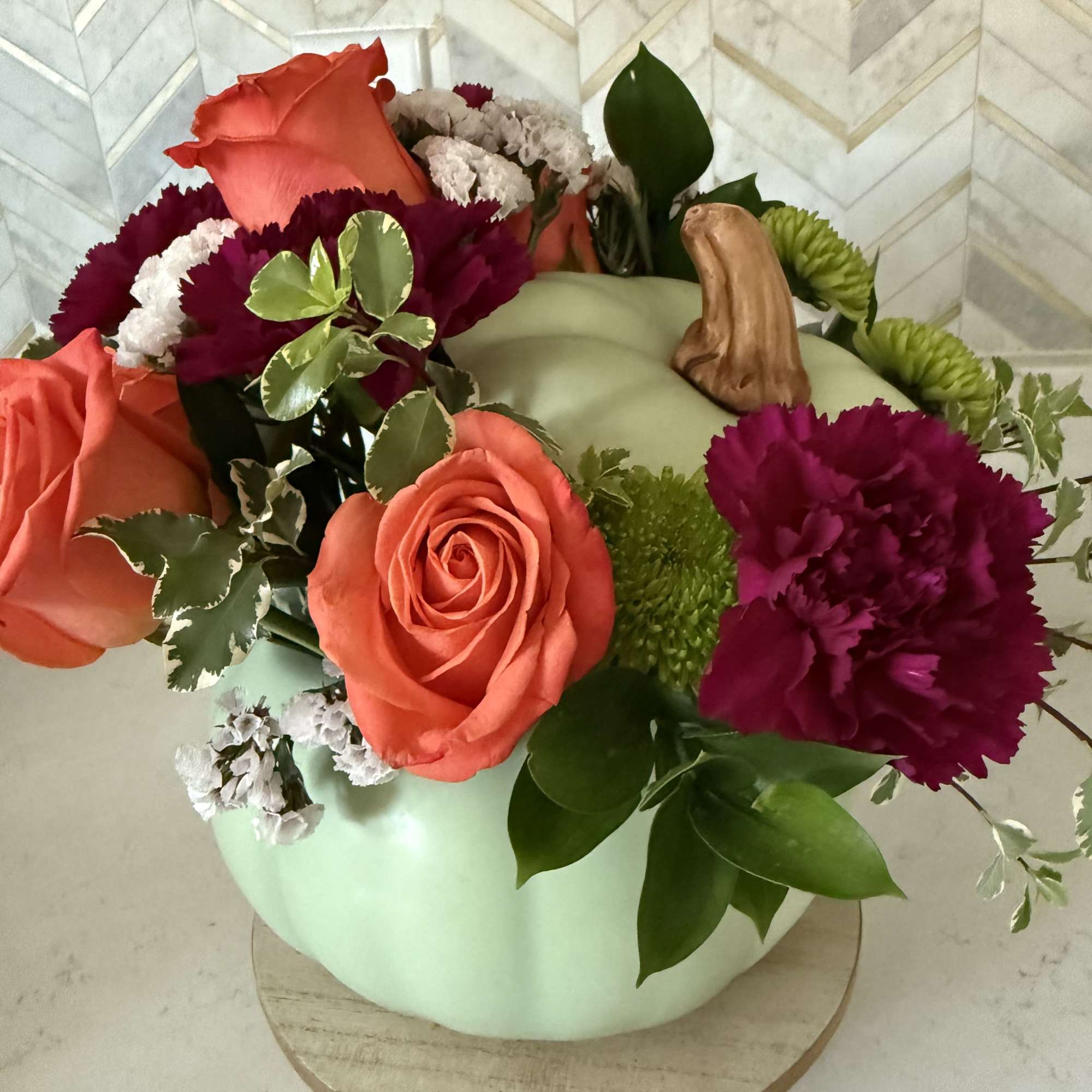 Designers choice sage pumpkin with fall flowers

Ceramic pumpkin will filled with in