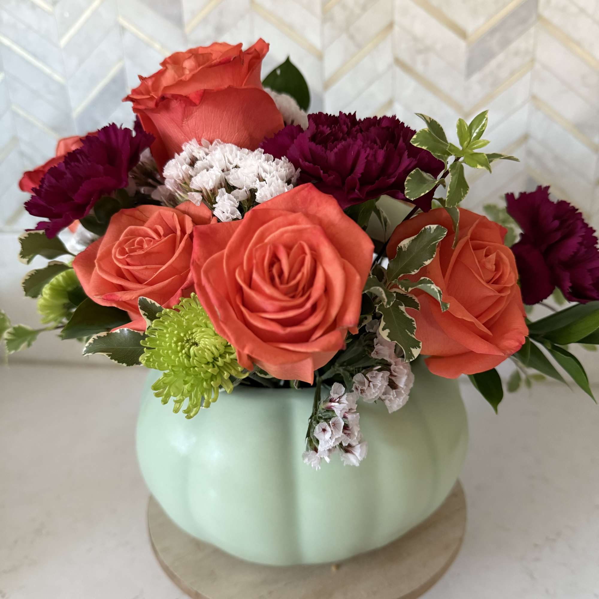 Designers choice sage pumpkin with fall flowers

Ceramic pumpkin will filled with in, photo 2 of 2