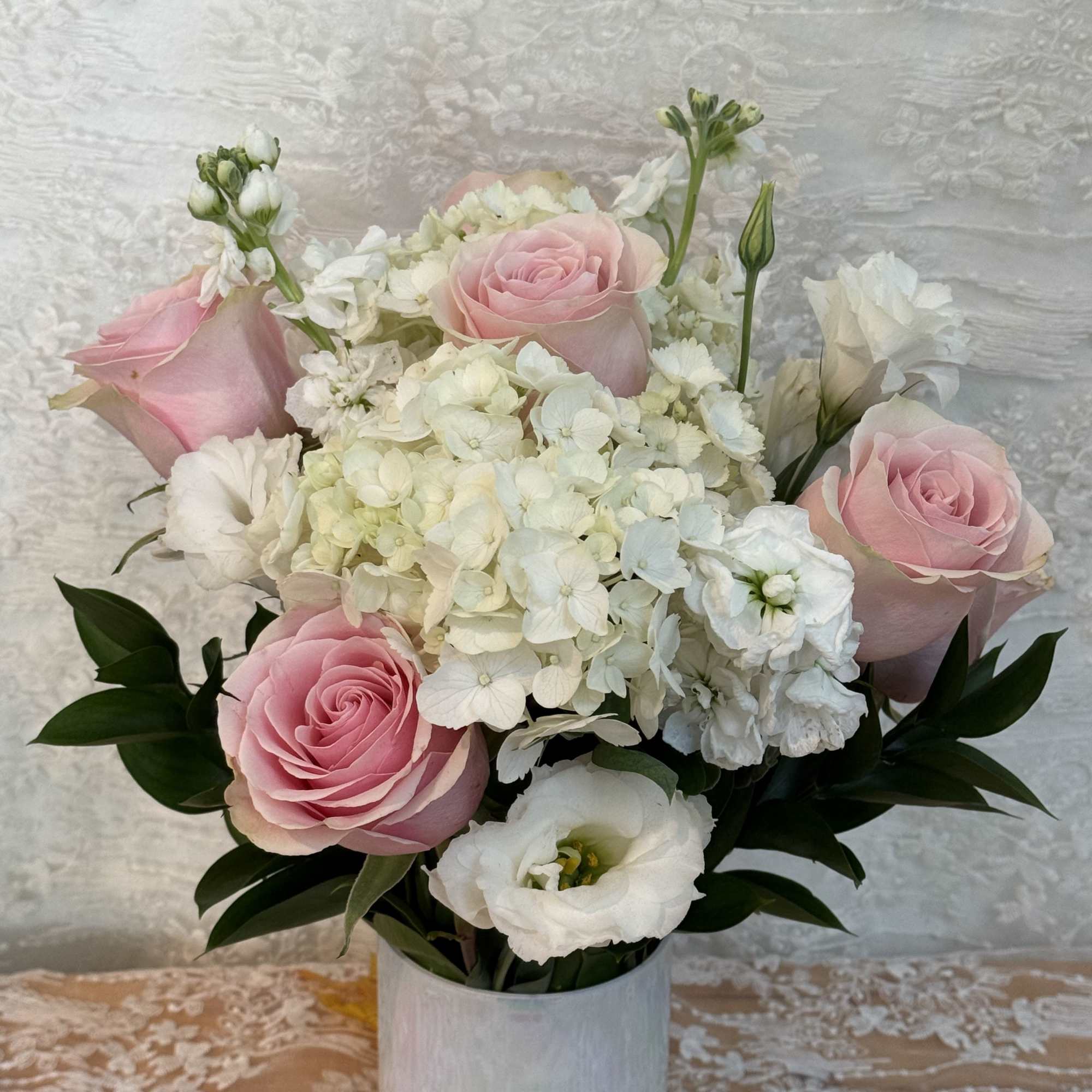 Soft pink and white flowers
Roses, hydrangeas and lisianthus 

If a particular flower
