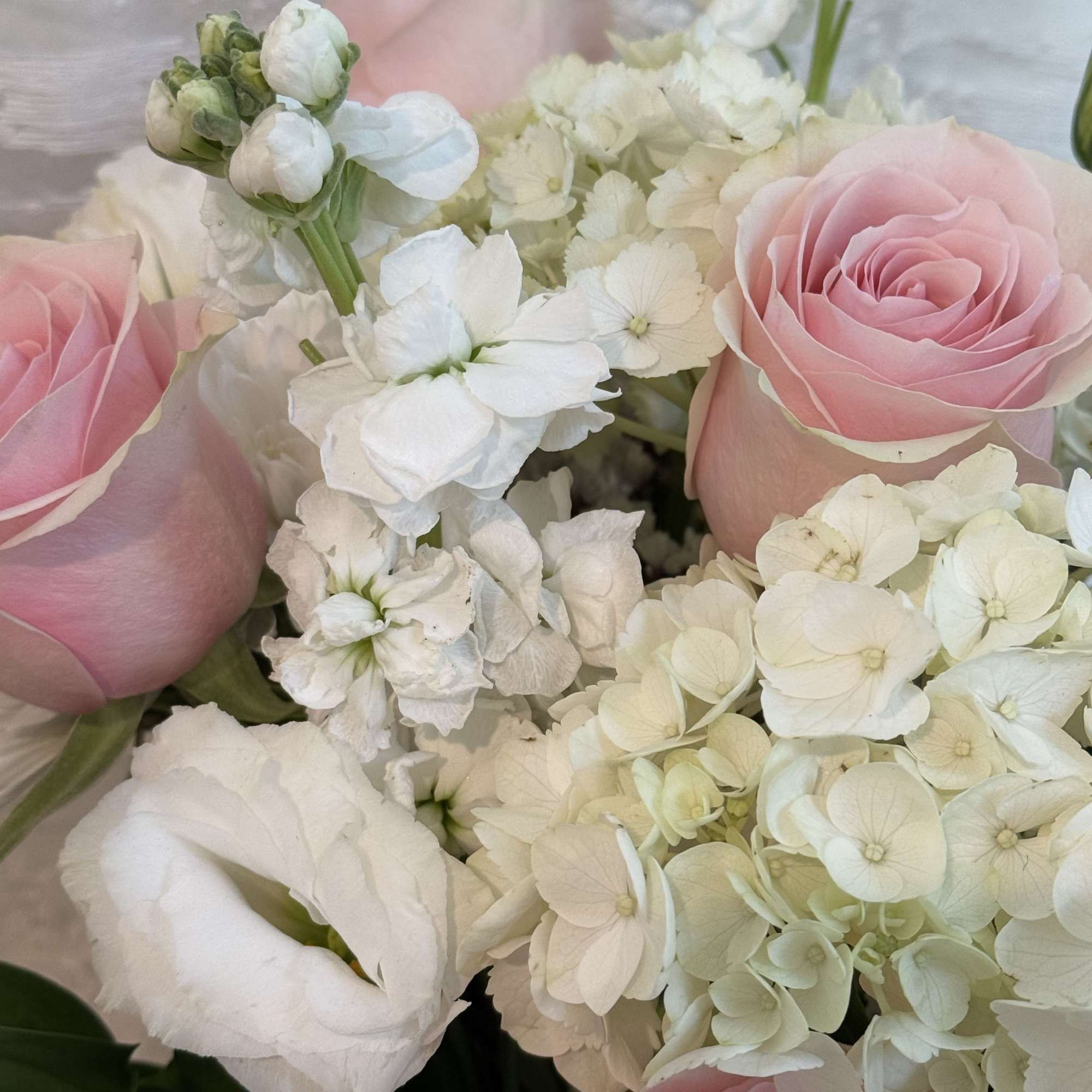 Soft pink and white flowers
Roses, hydrangeas and lisianthus 

If a particular flower, photo 3 of 3