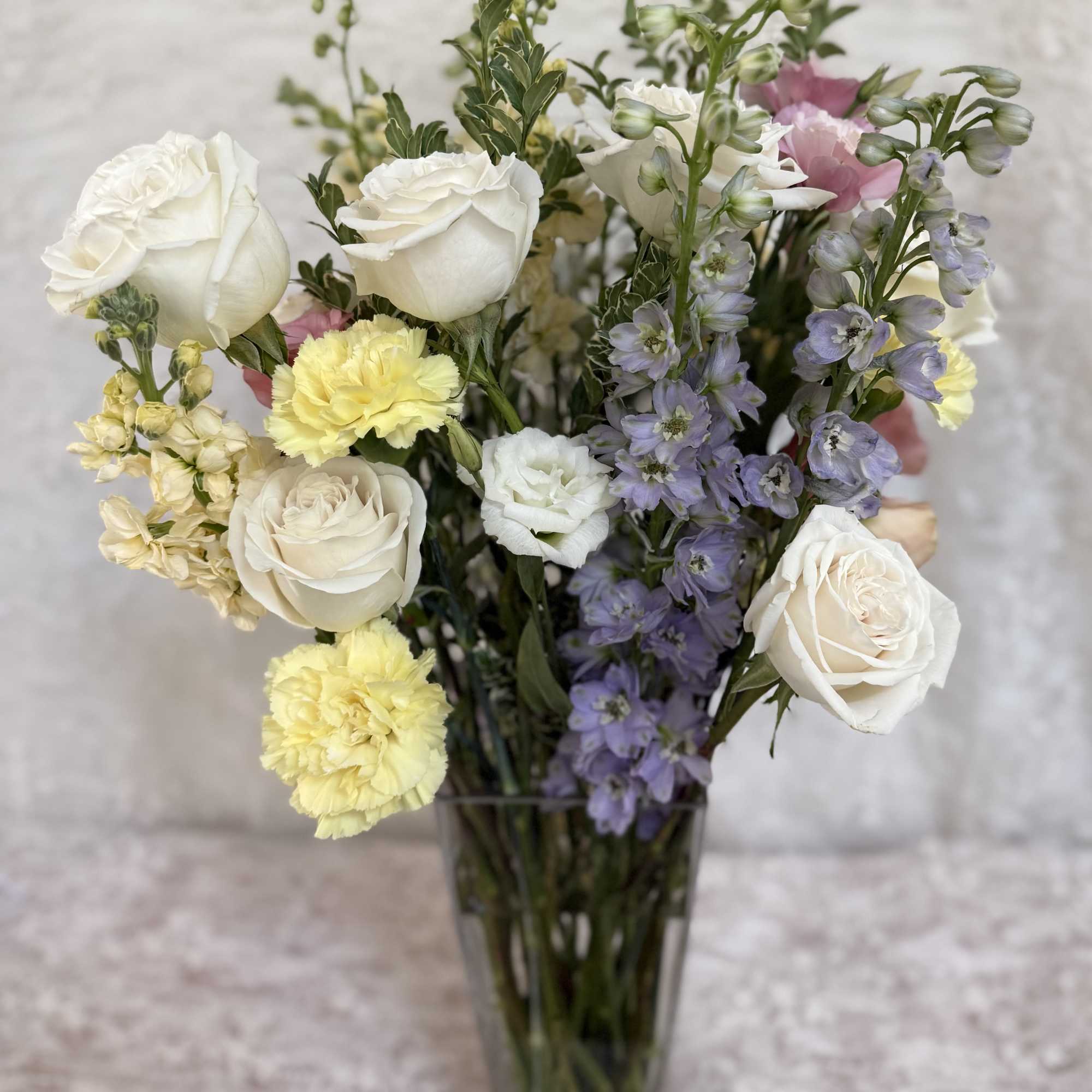 Tall 20 inch mix flower bouquet 
Delphinium, roses, carnations, stock and lisianthus.