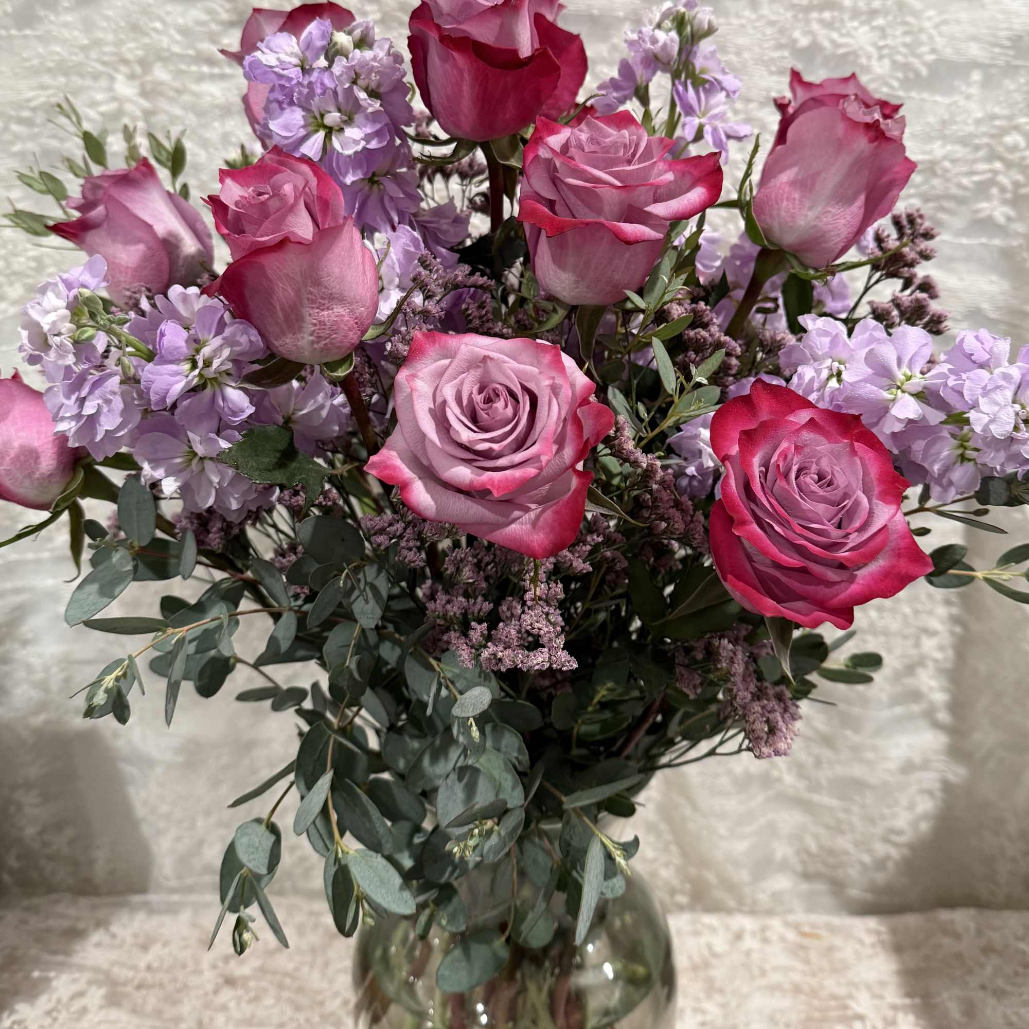 One dozen lavender roses with lavender stock and eucalyptus.

If a particular flower