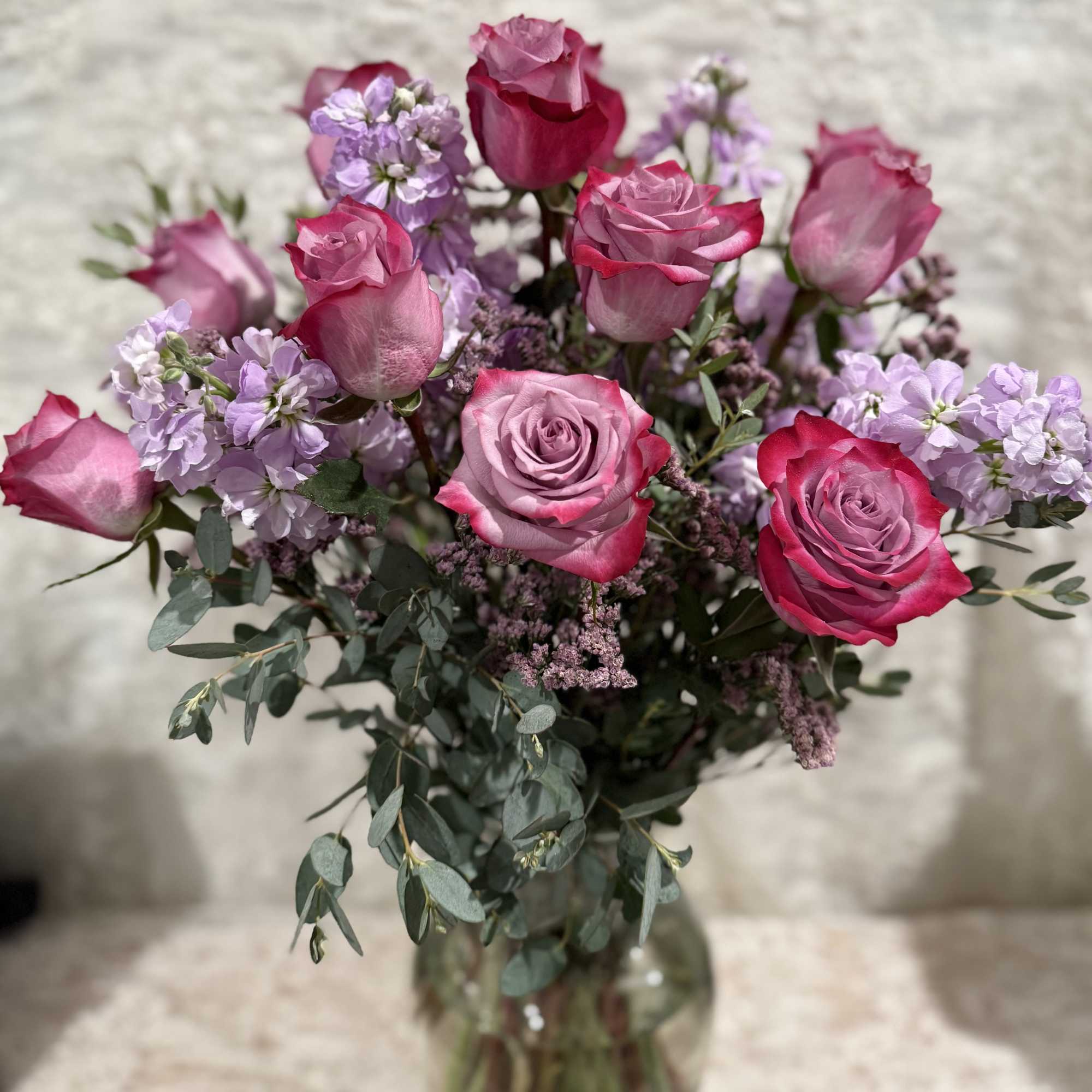 One dozen lavender roses with lavender stock and eucalyptus.

If a particular flower, photo 2 of 2