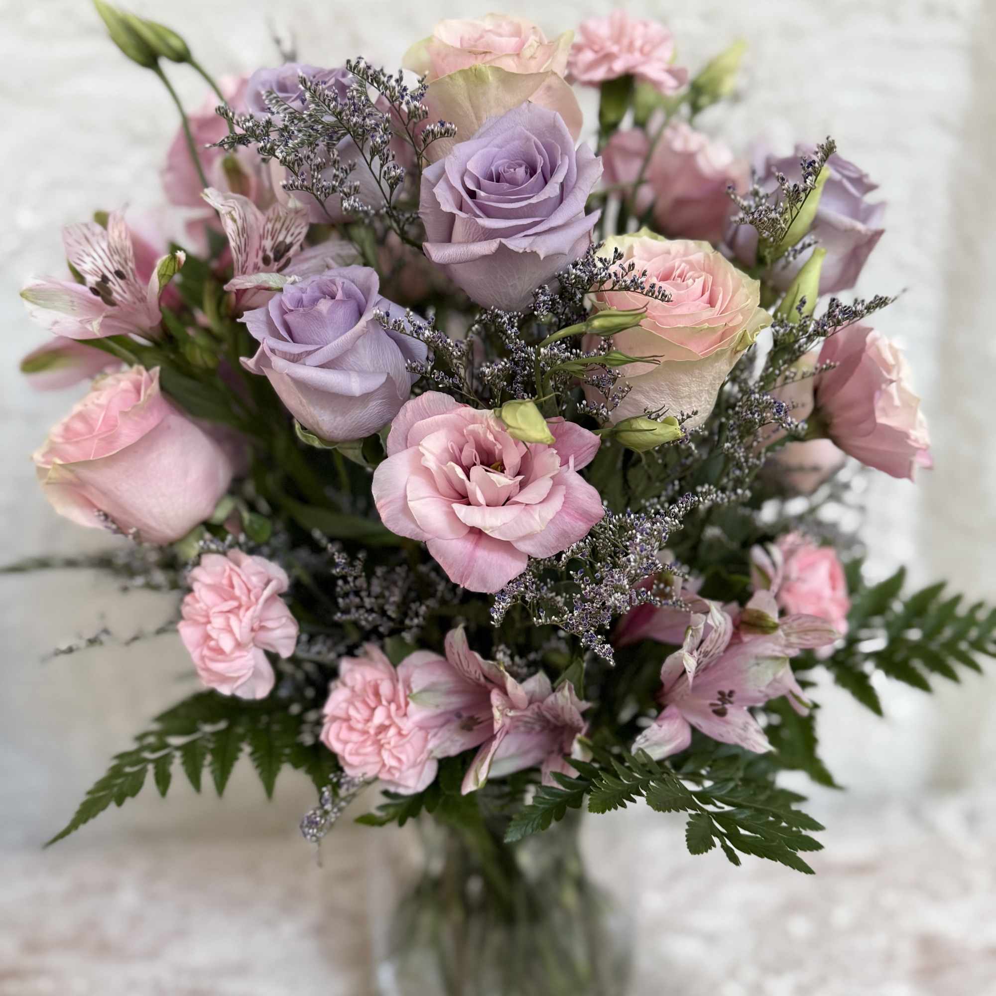 Send your loved one some birthday wishes 

Mix arrangement of light pink, photo 2 of 3
