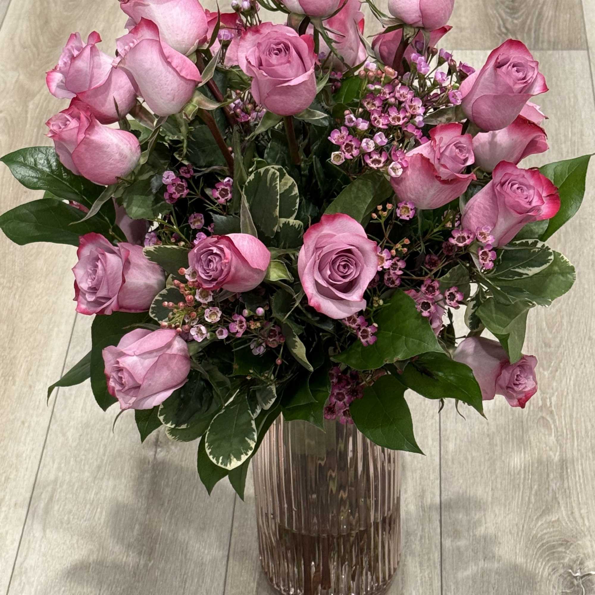 Beautiful lavender bouquet
 
Dark lavender bicolor roses, wax flower and in season, photo 2 of 2