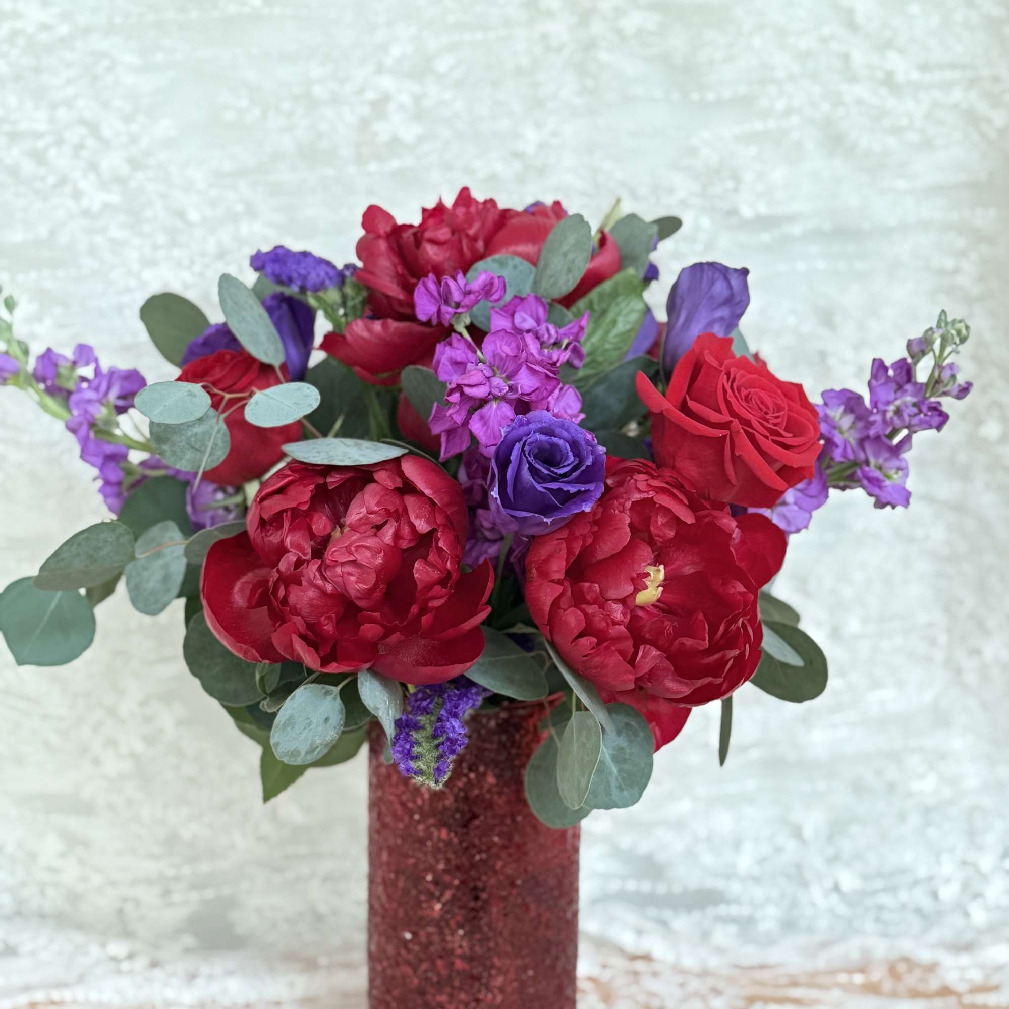 Peonies, roses, lisianthus, stock, statice and eucalyptus 
