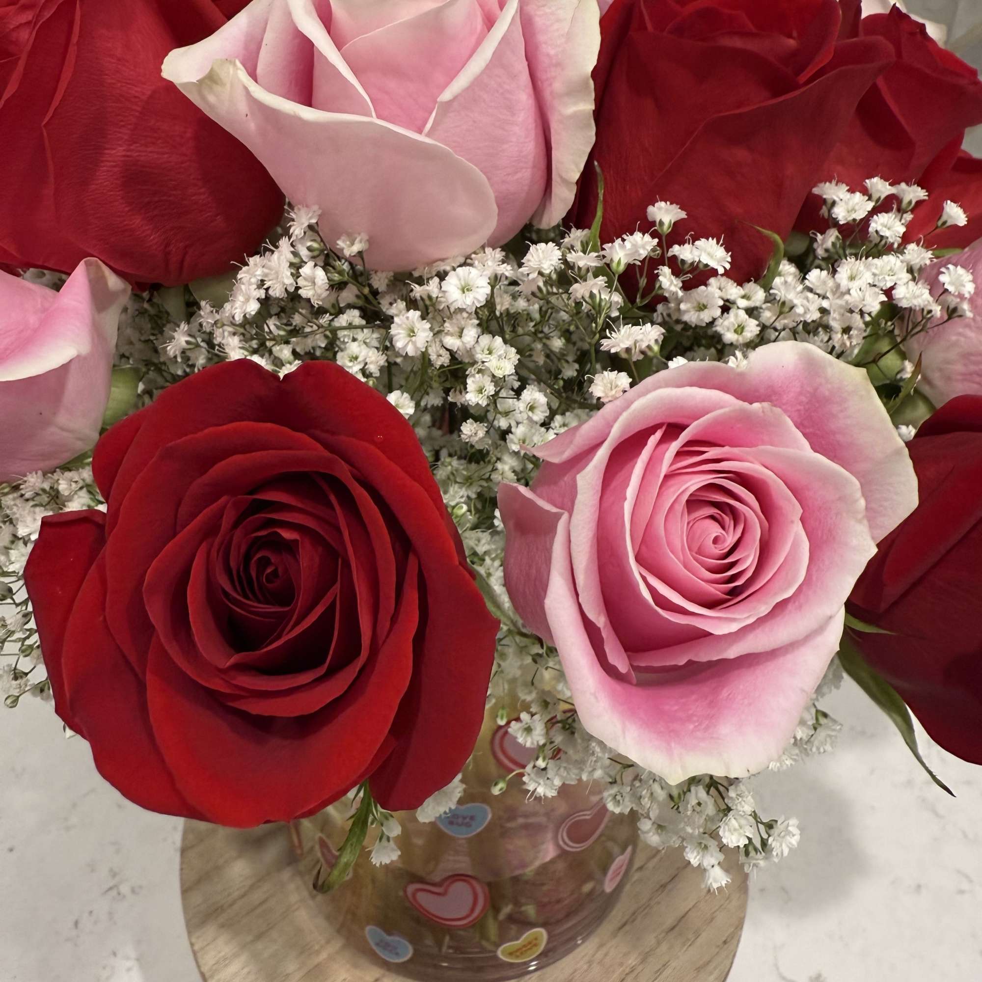 Mix of red and pink roses in a sweetheart vase

Two dozen roses, photo 2 of 3