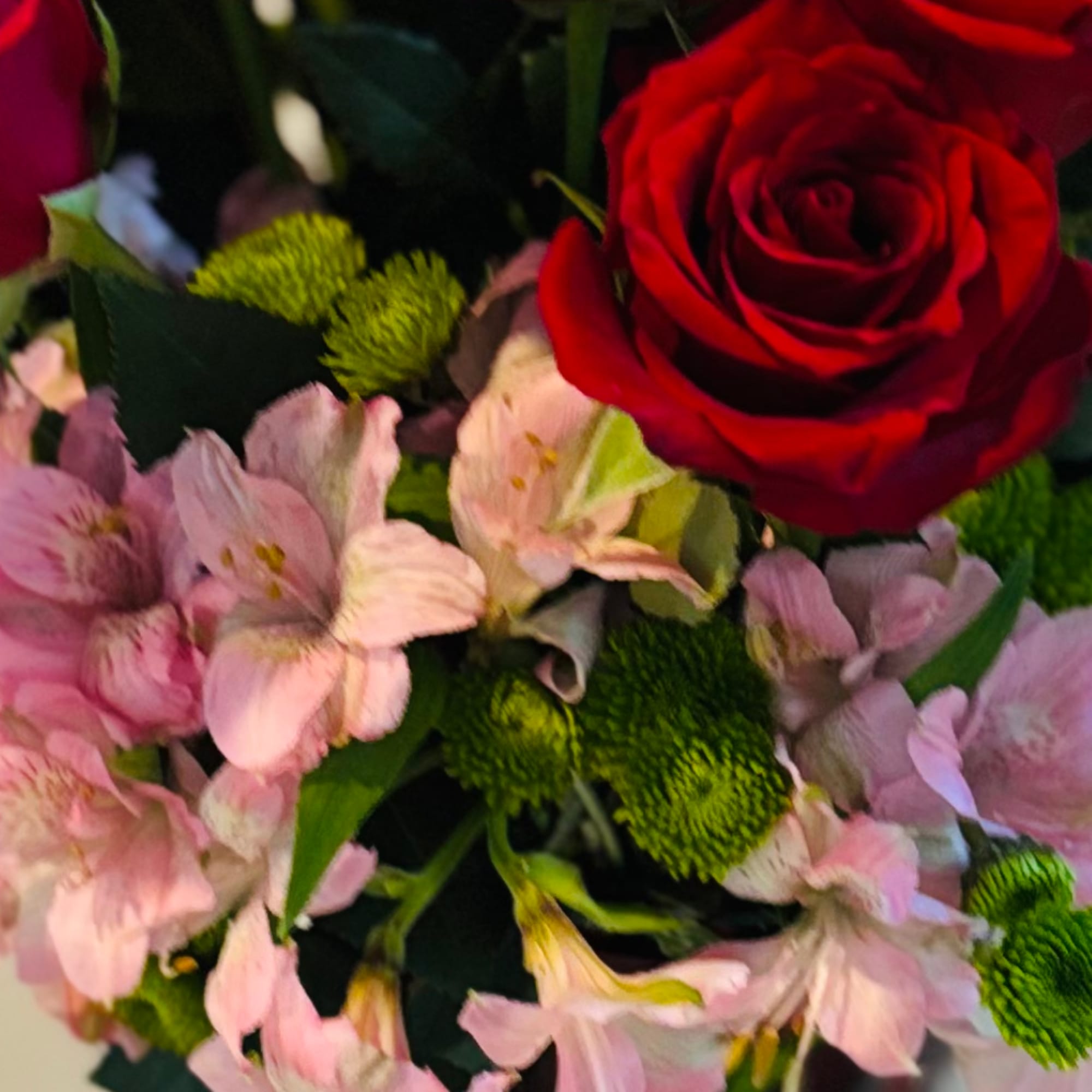 Bouquet of red roses and pale pink alstroemeria flowers
