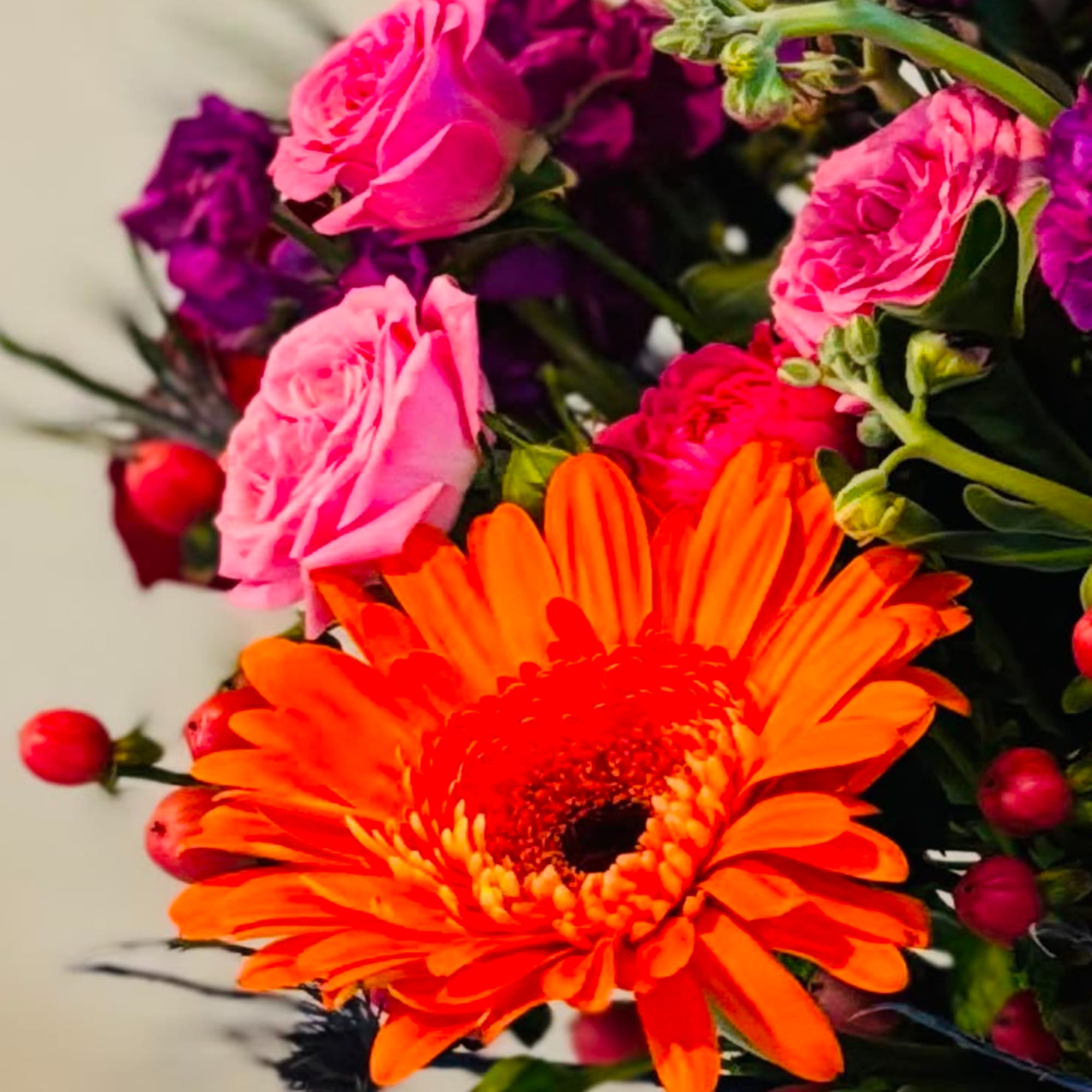 Bright bouquet with orange gerbera daisies and pink roses