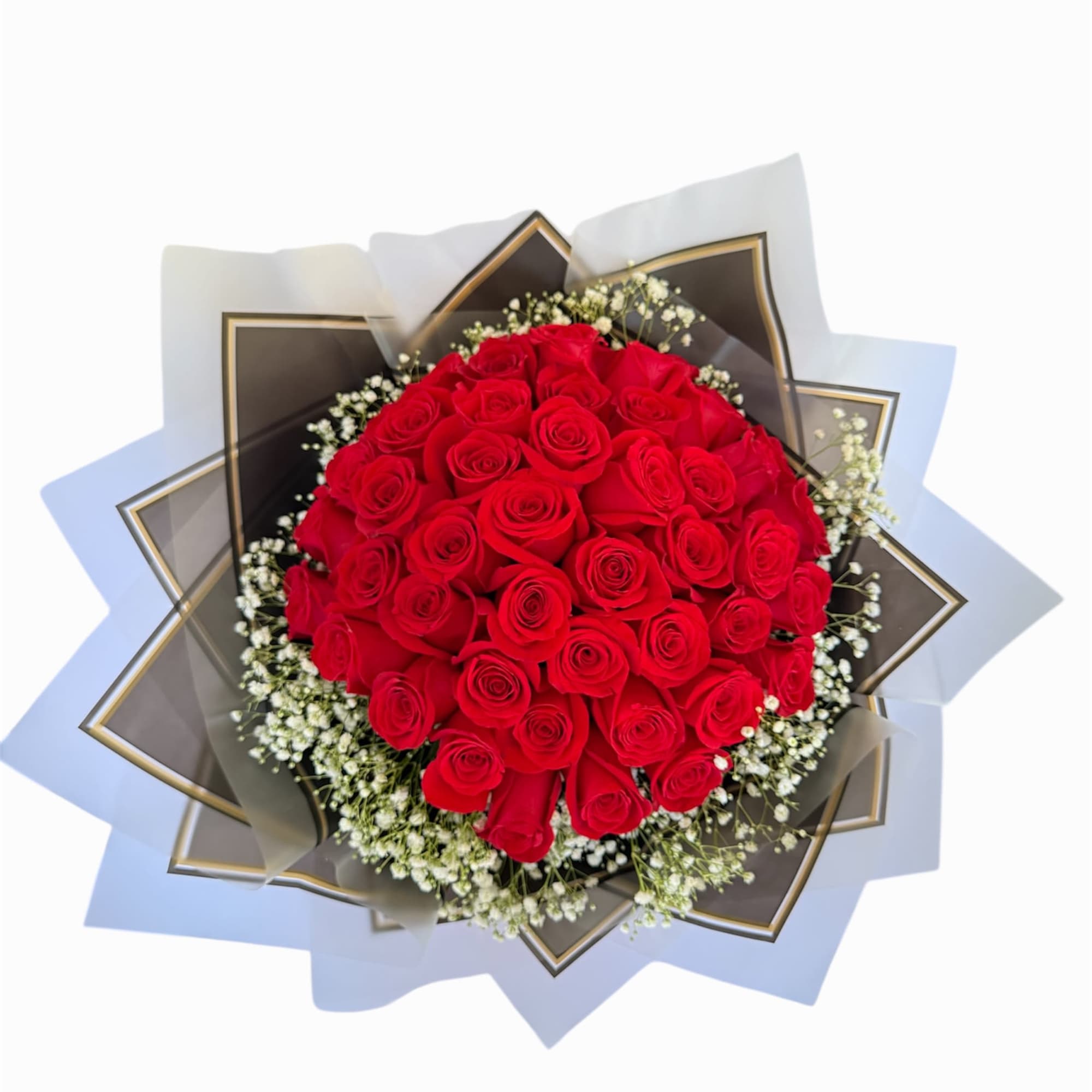Round bouquet of red roses with white baby's breath wrapping