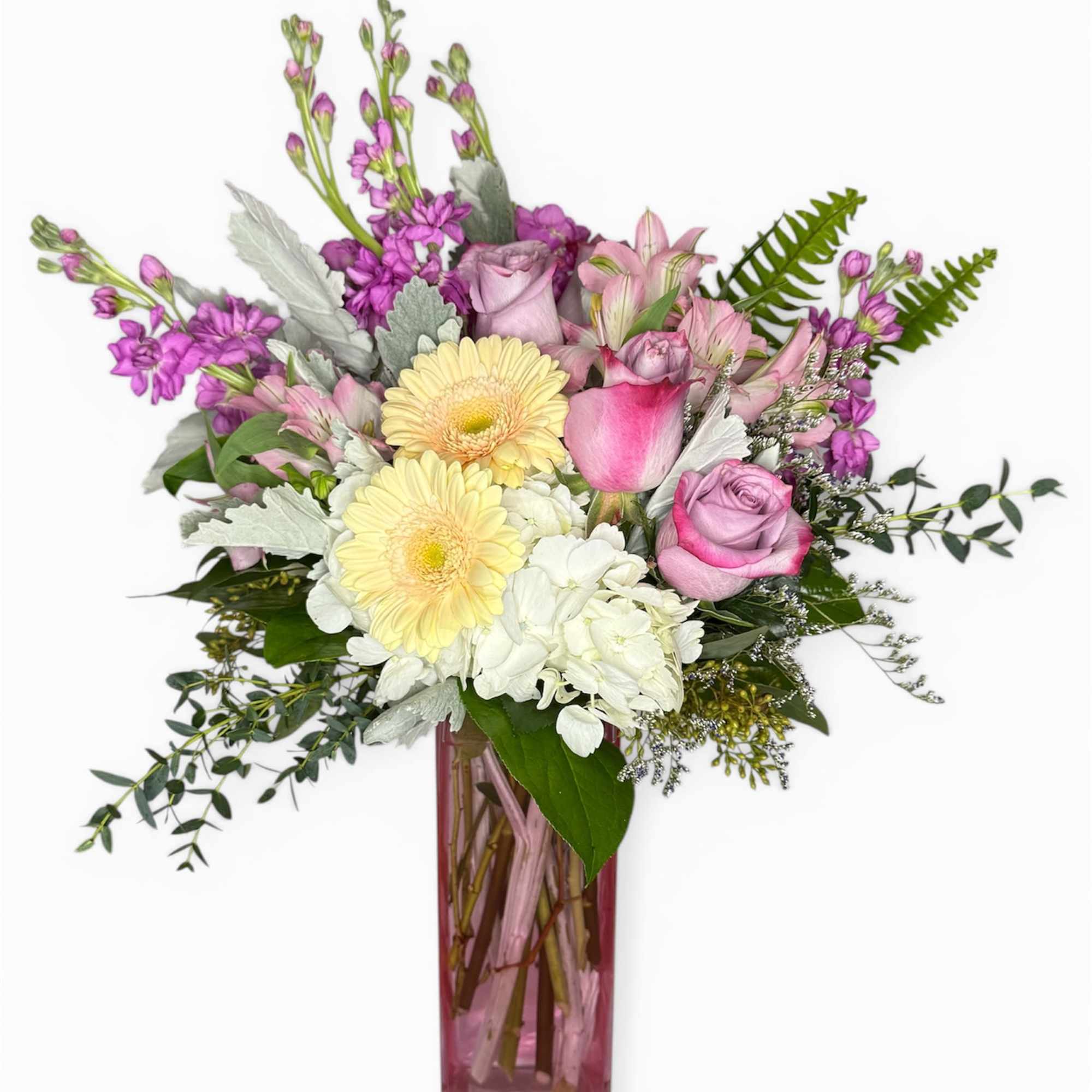 A delicate blend of blush roses, creamy blooms, and soft lavender accents
