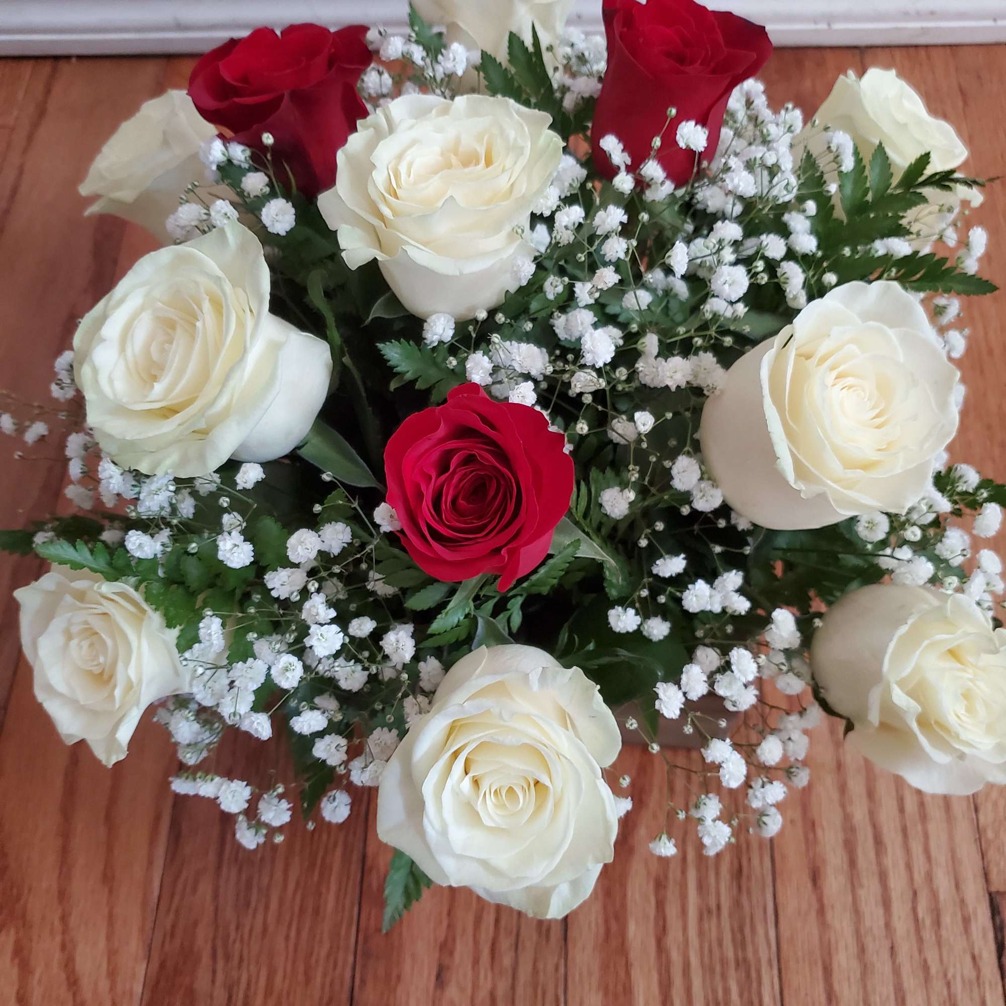 Standard: 9 White and 3 Red Rose's
Deluxe:12 White roses and 6 red, photo 2 of 2