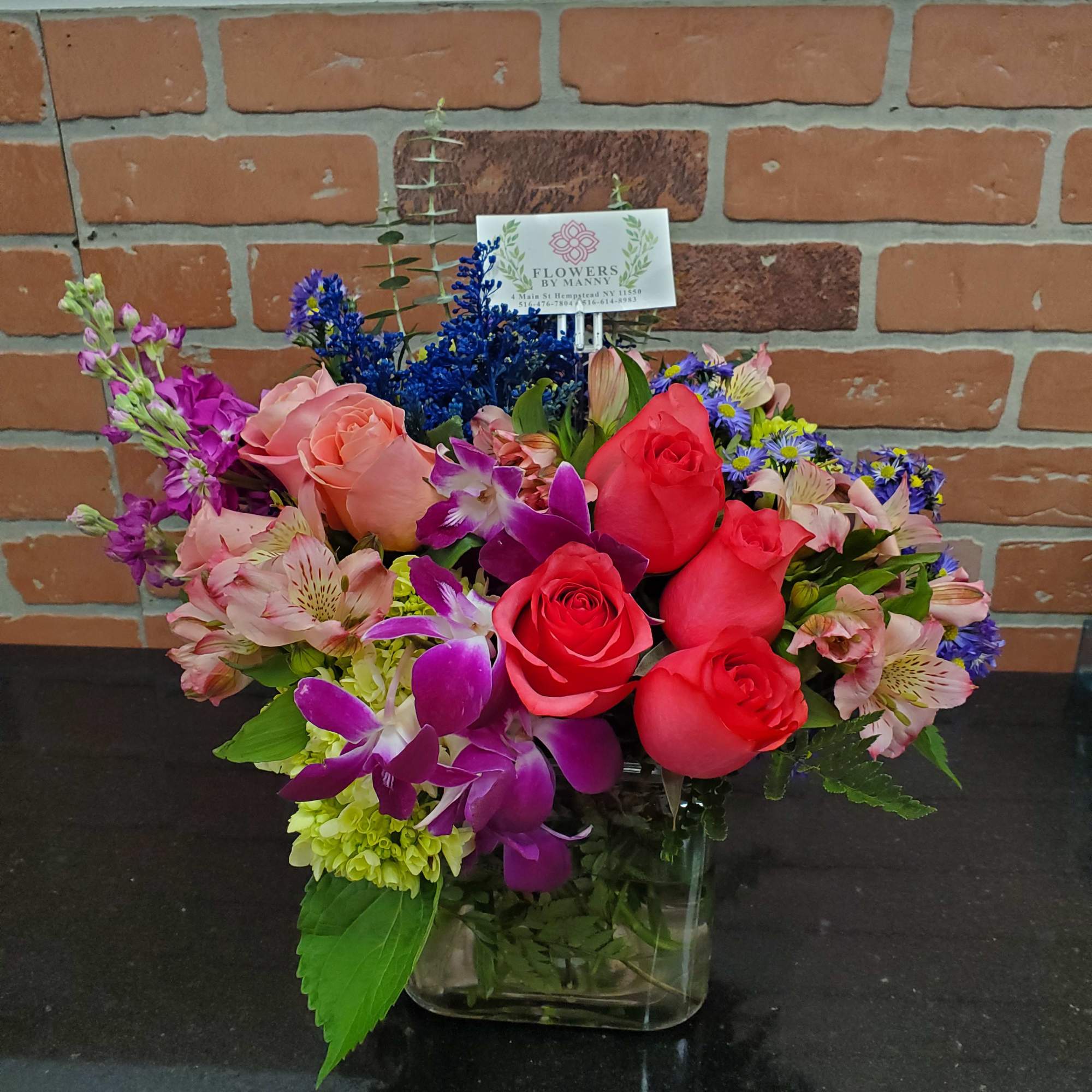 Mixed flowers for a garden looking arrangement., photo 2 of 2