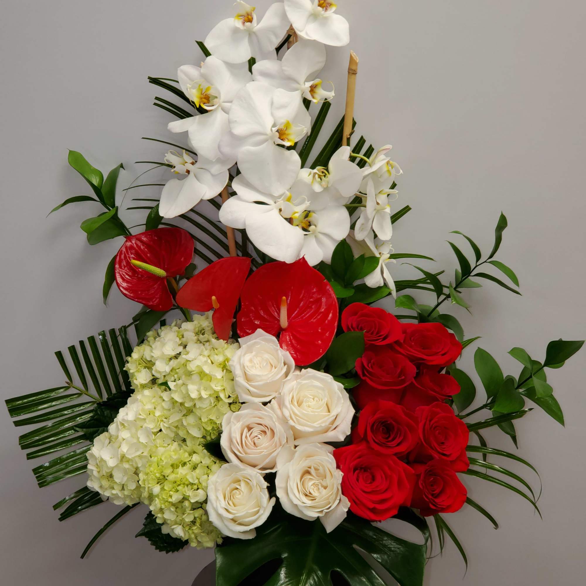 Tropical romance is a beautiful romantic arrangement with orchid, roses, hydrangea and, photo 2 of 3