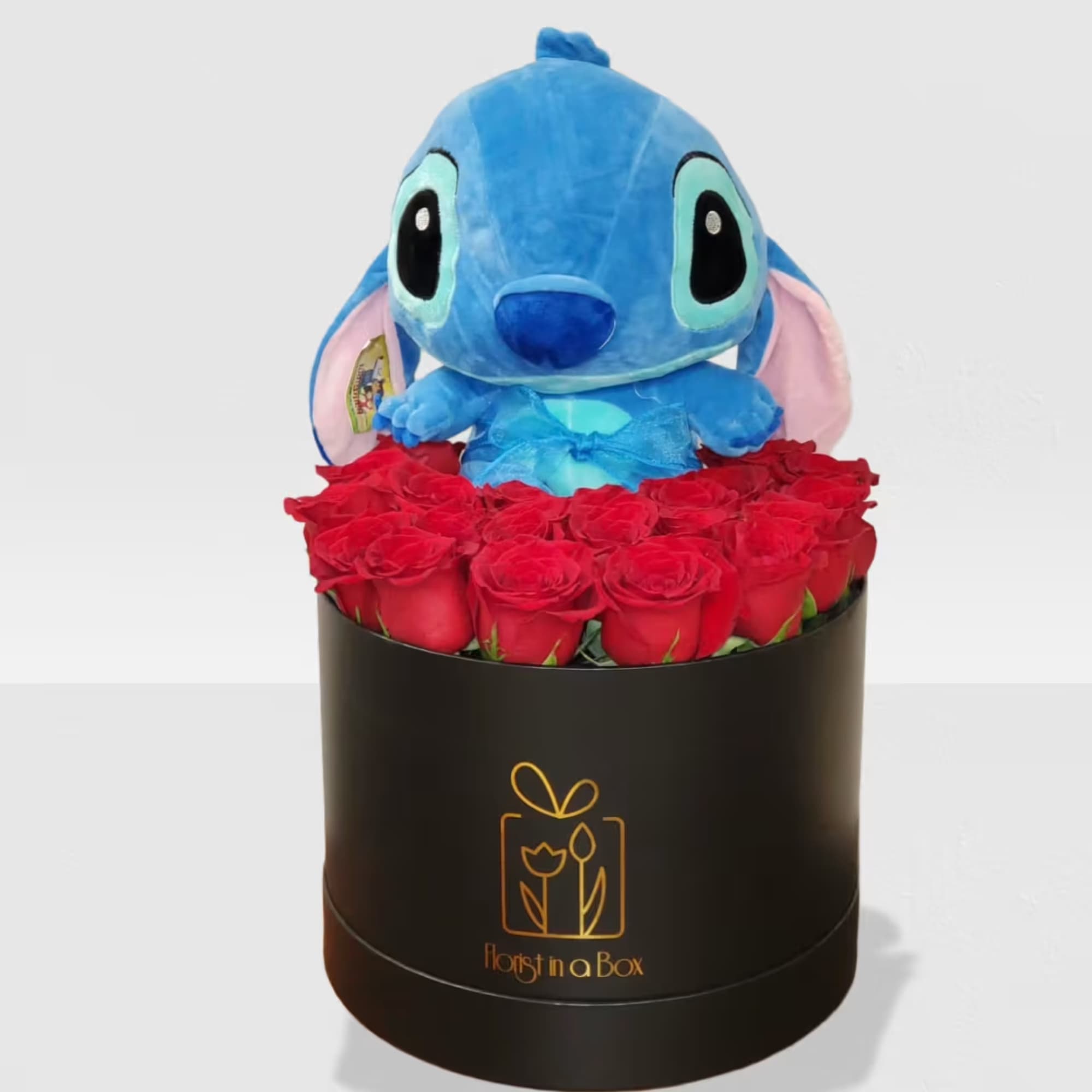Stitch surrounded by red roses in a box 
NOTICE BOX MAY BE, photo 2 of 2