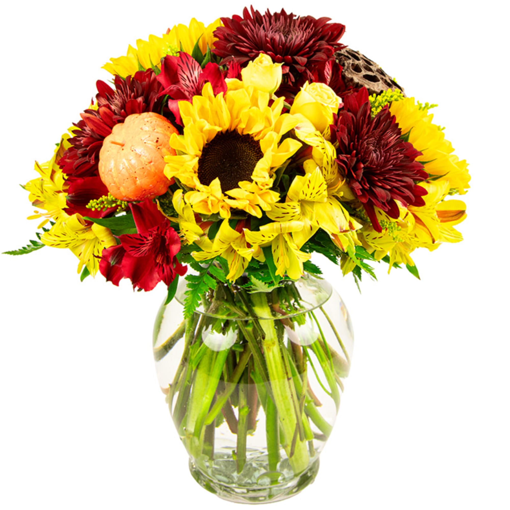 Bouquet of yellow and red flowers in a clear glass vase