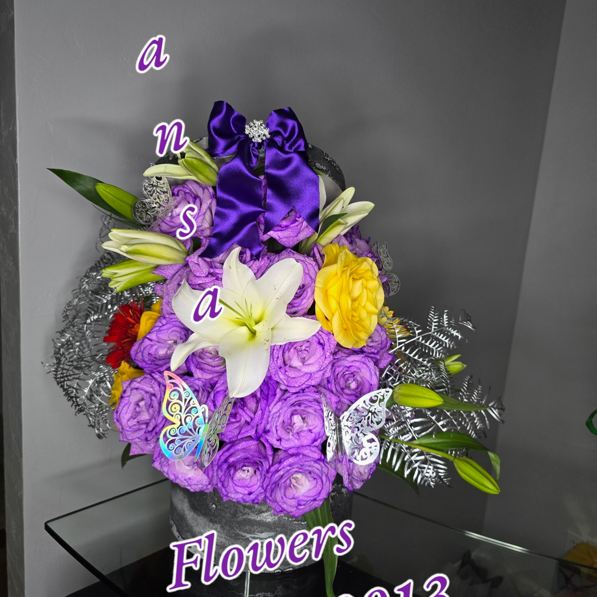  Purple Mixed Floral Arrangement in Round Box 
Elegant, mysterious, and full