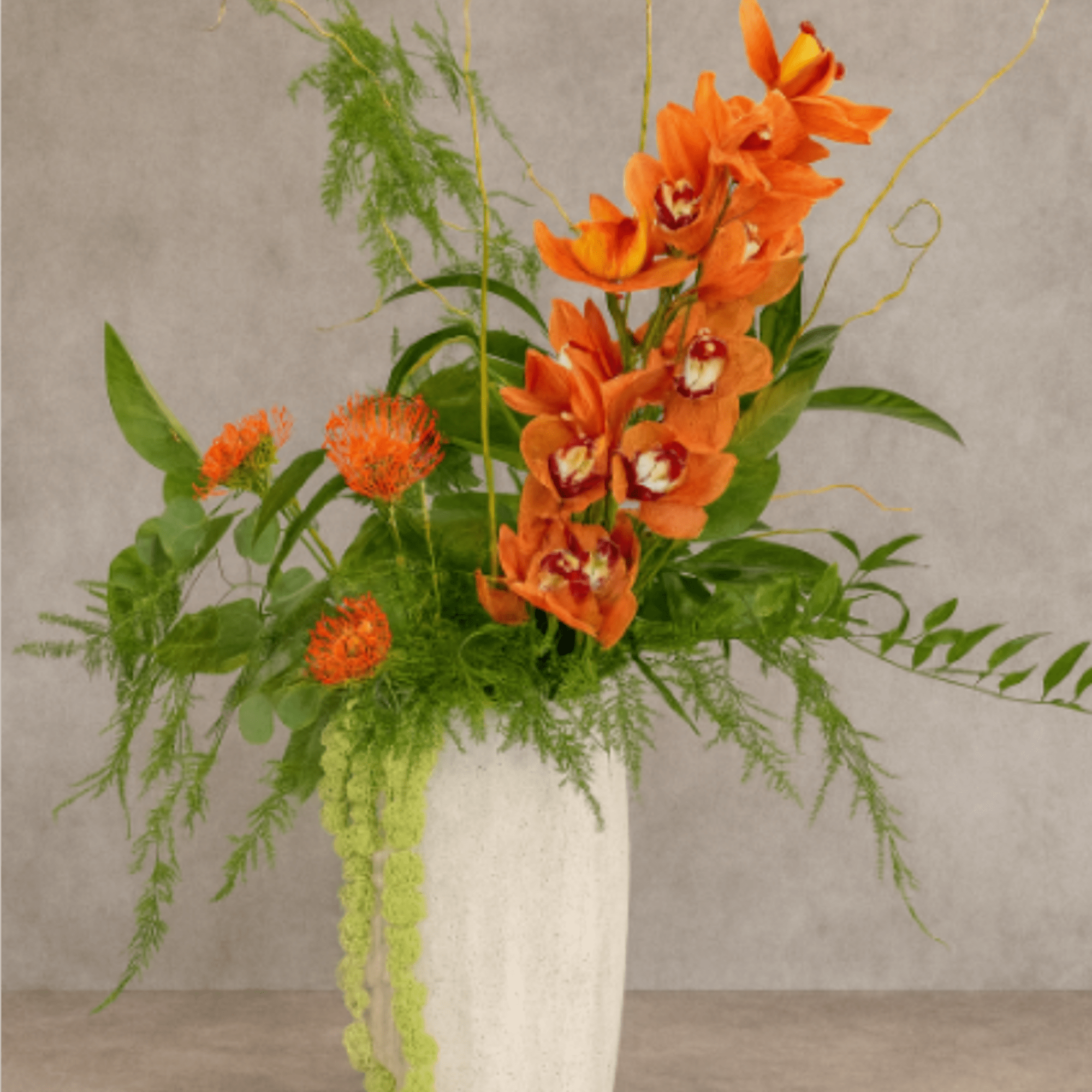 Eden is a premium floral arrangement featuring tropical blooms and bold botanical