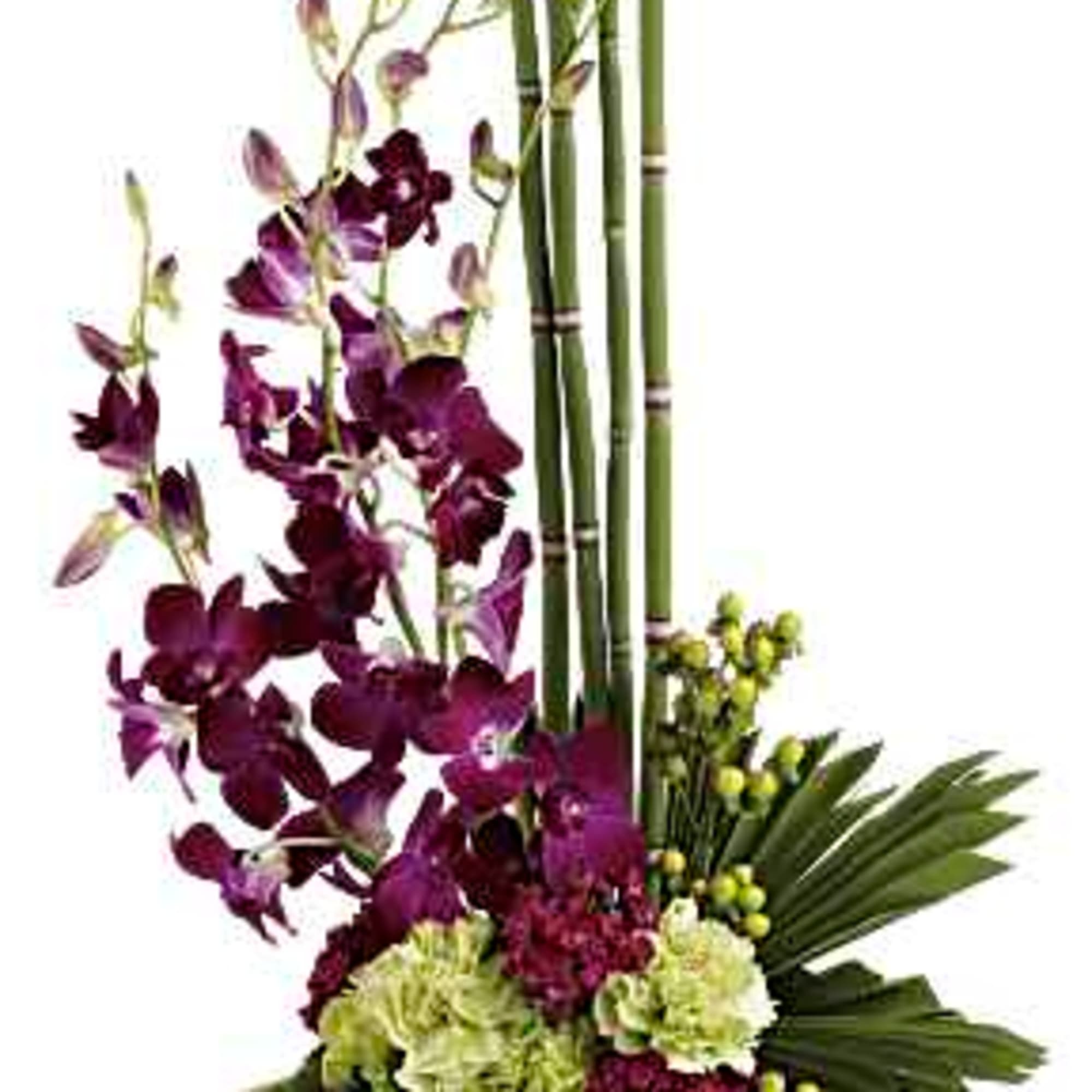 Tall floral arrangement with purple orchids and green hydrangeas in a wooden base