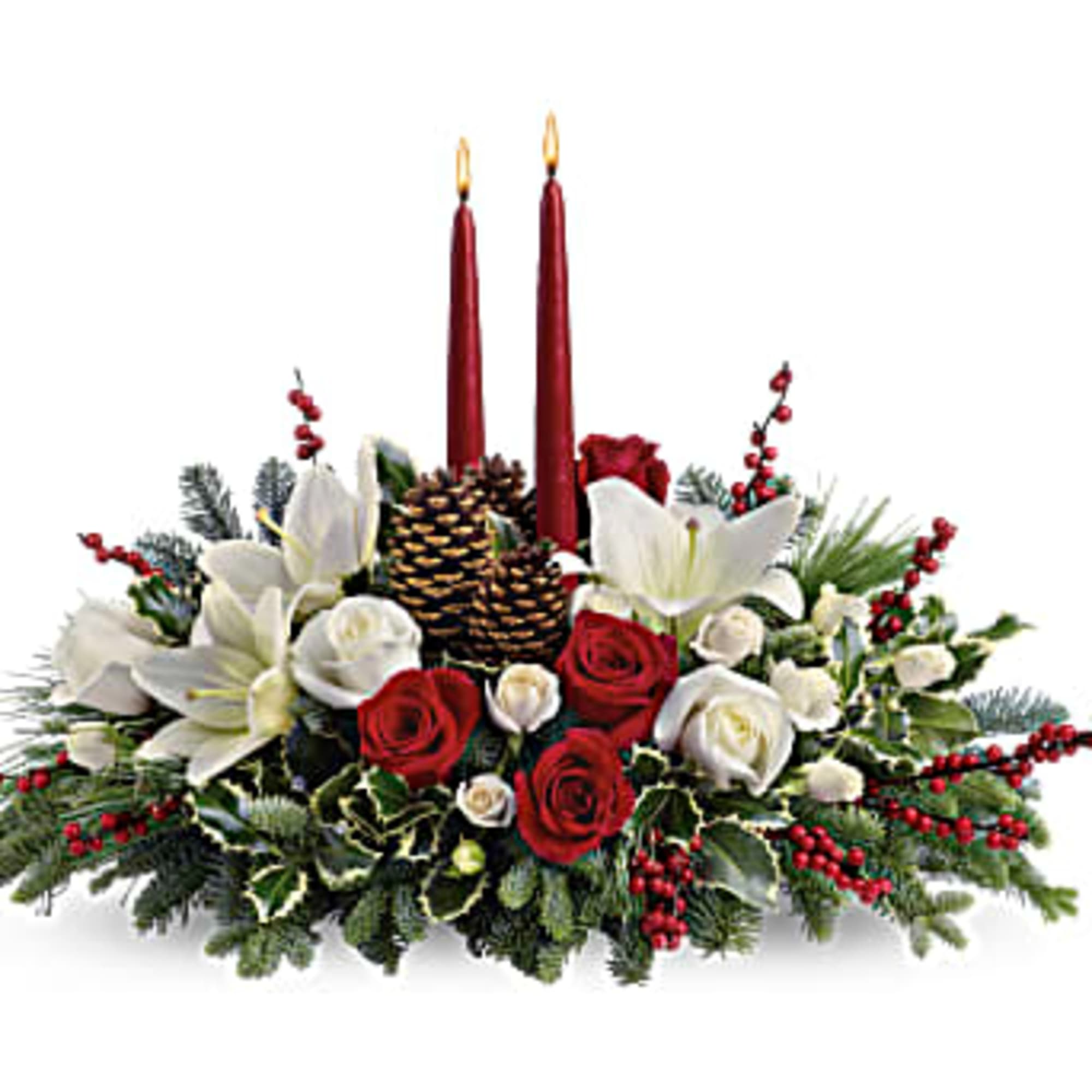 Holiday centerpiece with red candles, white lilies, and red roses
