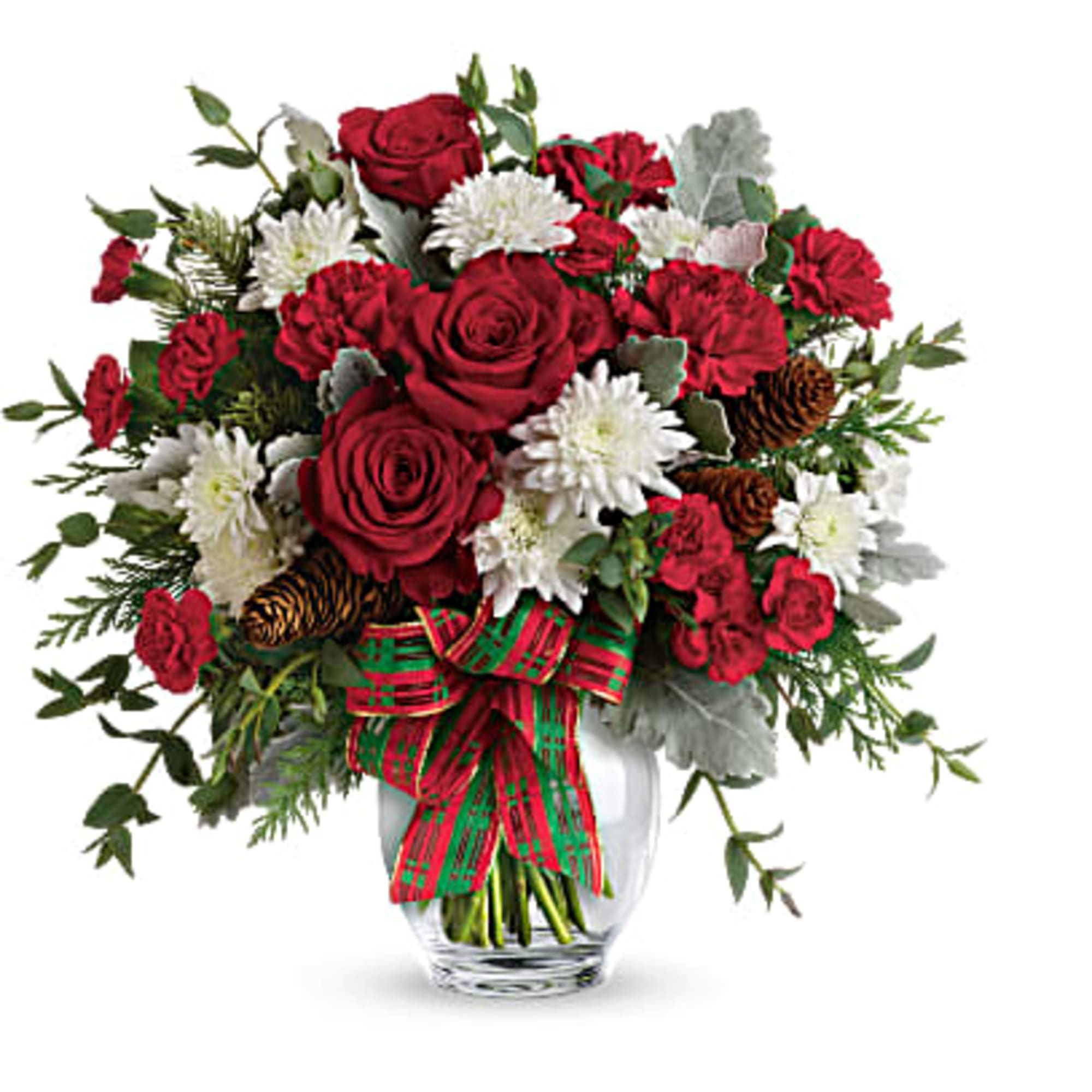 Red roses and white flowers in a glass vase with a plaid ribbon