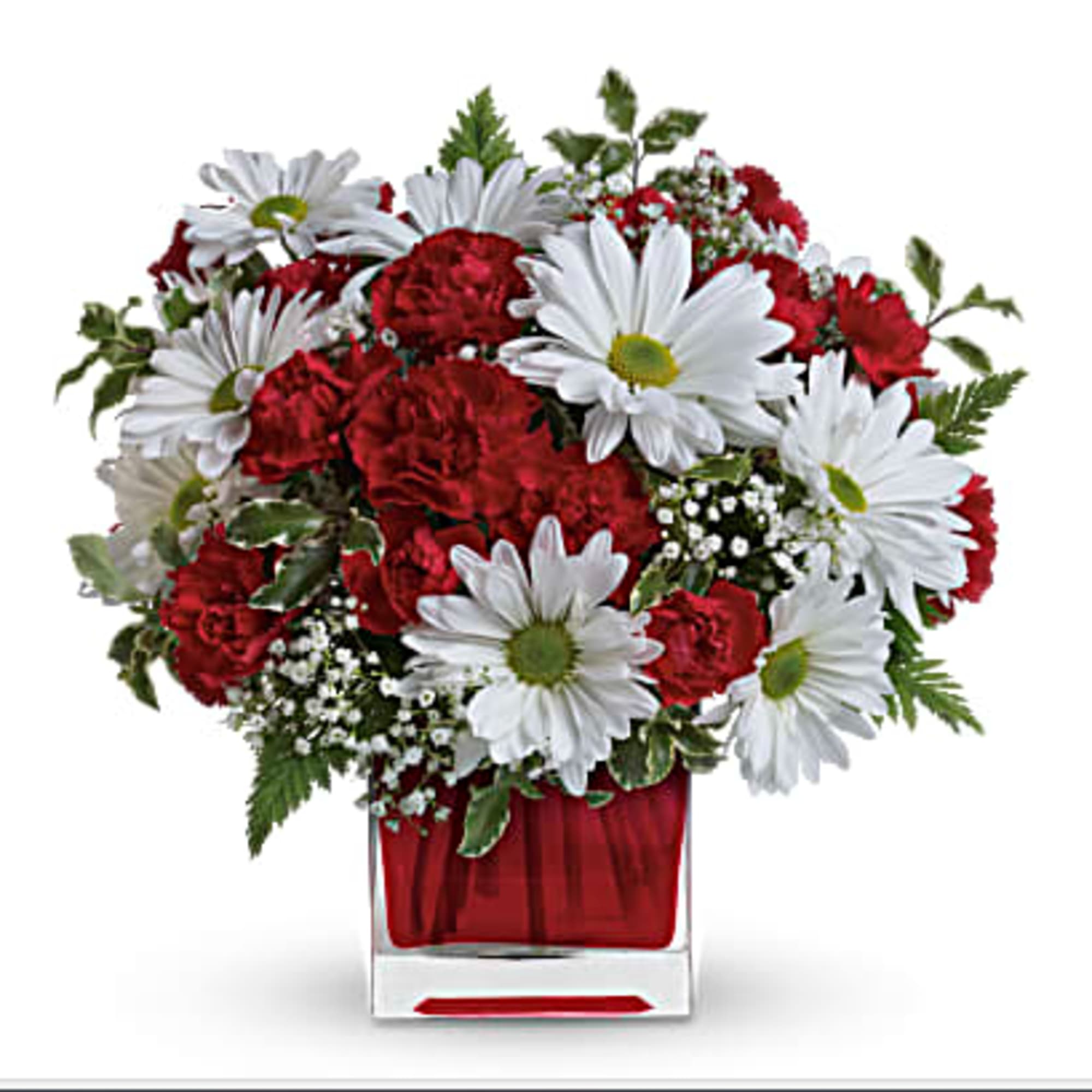 Red carnations and white daisies in a red glass vase
