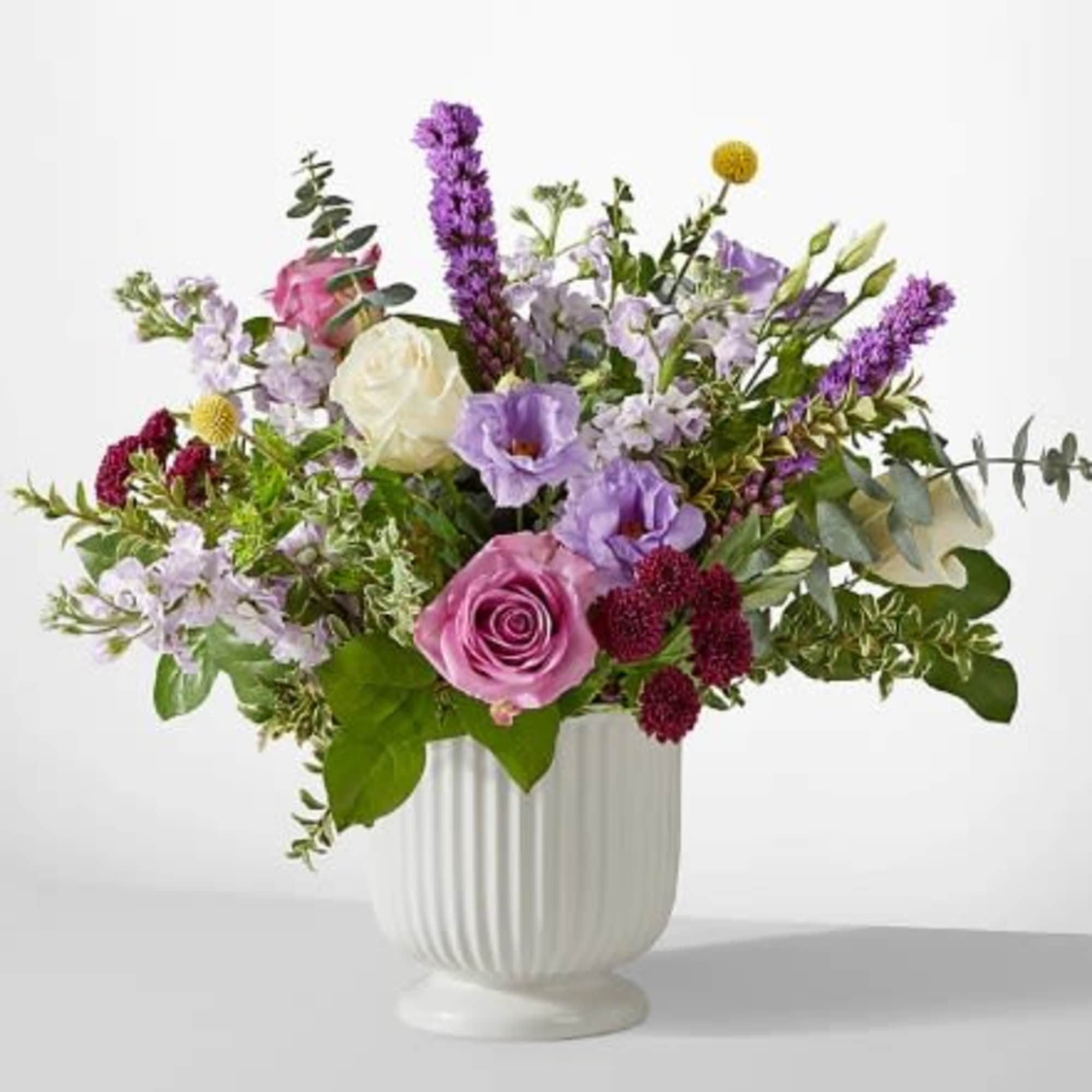 A true work of art, this grand bouquet of purple, lavender and