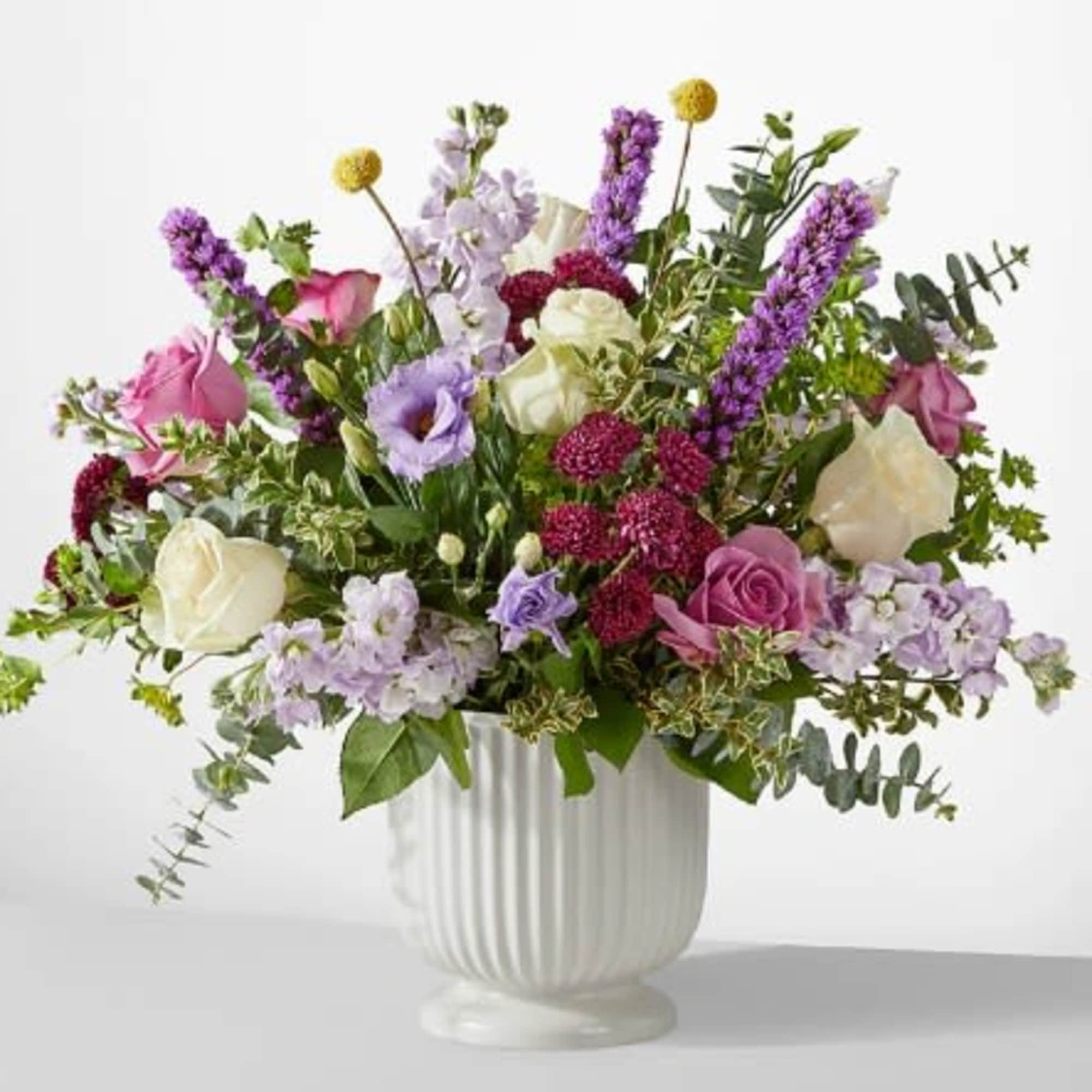 A true work of art, this grand bouquet of purple, lavender and