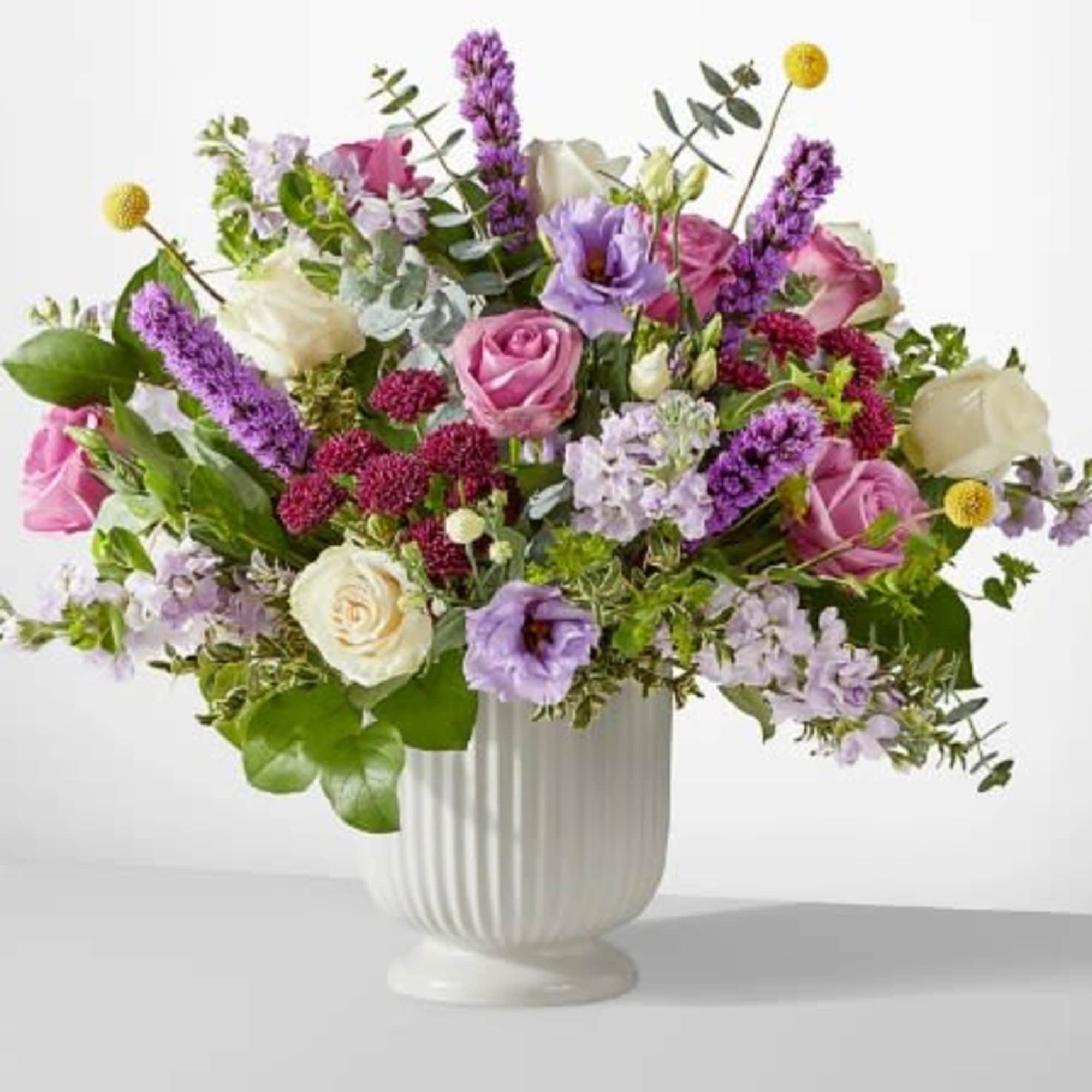 A true work of art, this grand bouquet of purple, lavender and